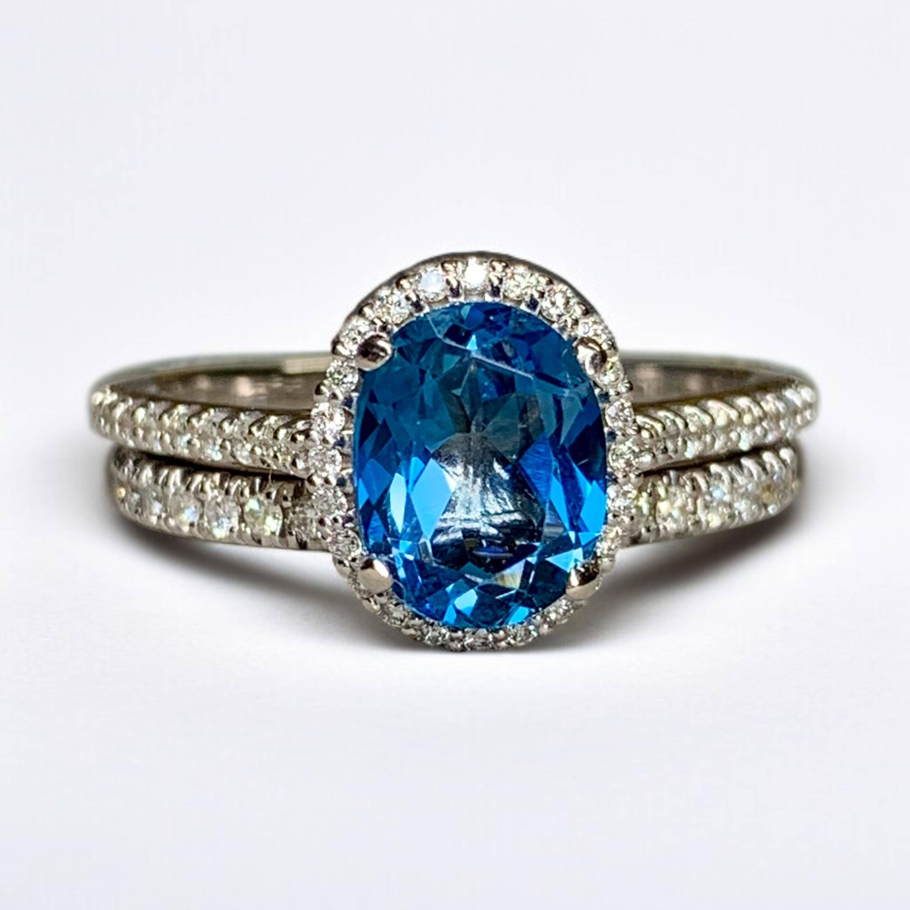 
A 14K solitaire ring and band set by NEIL LANE done in 14K white gold centered by a 2.34ct oval indicolte tourmaline surrounded by approximately .70ctw in G-H color Vs2-Si1 clarity round diamonds.


Dimensions/Weight:

This ring weighs 6g and is a
