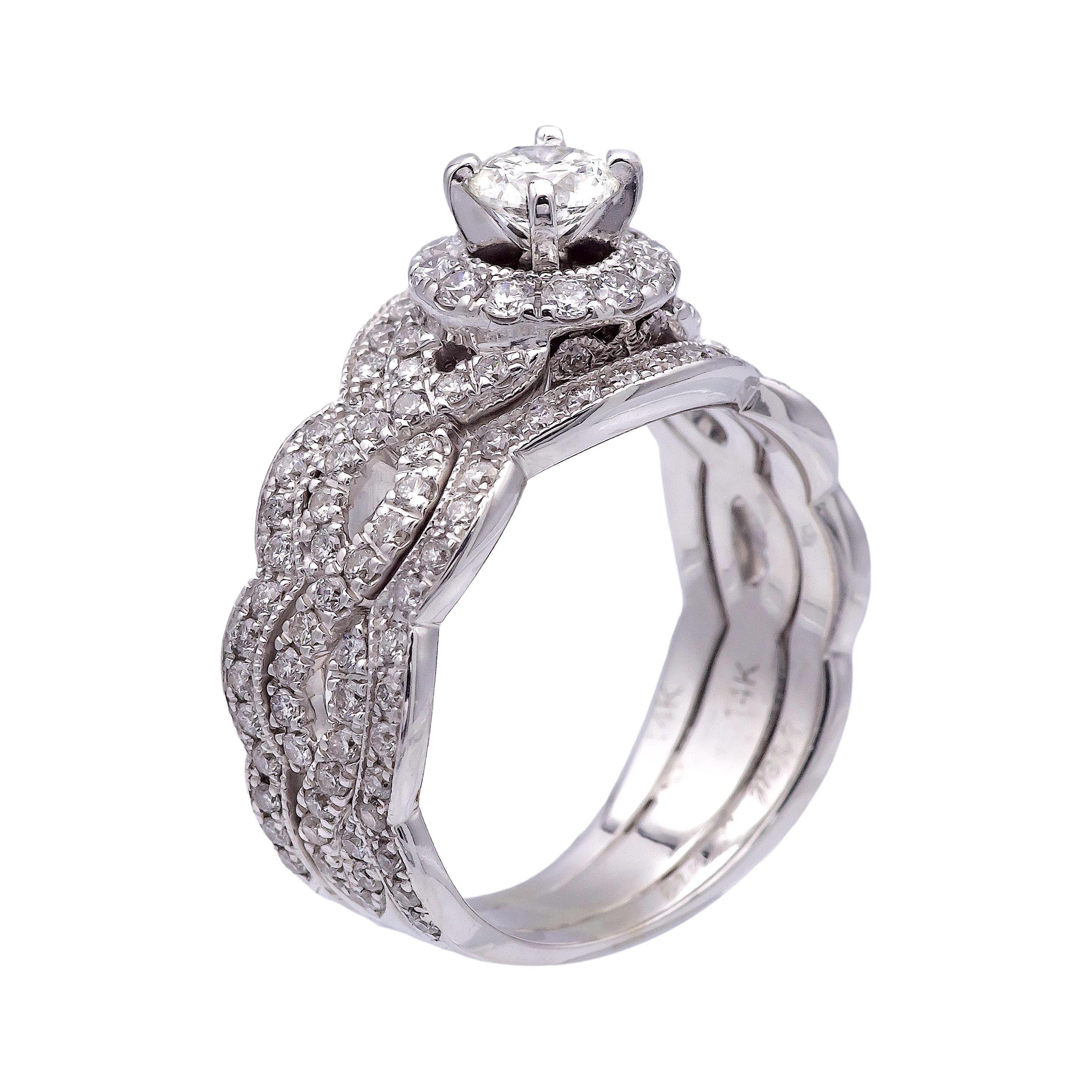 Neil Lane diamond engagement ring, meticulously crafted in 14 karat white gold featuring a mesmerizing round brilliant cut diamond, weighing approximately 0.36 carats, exuding brilliance and elegance ranging H-I color and SI2 clarity. Surrounding