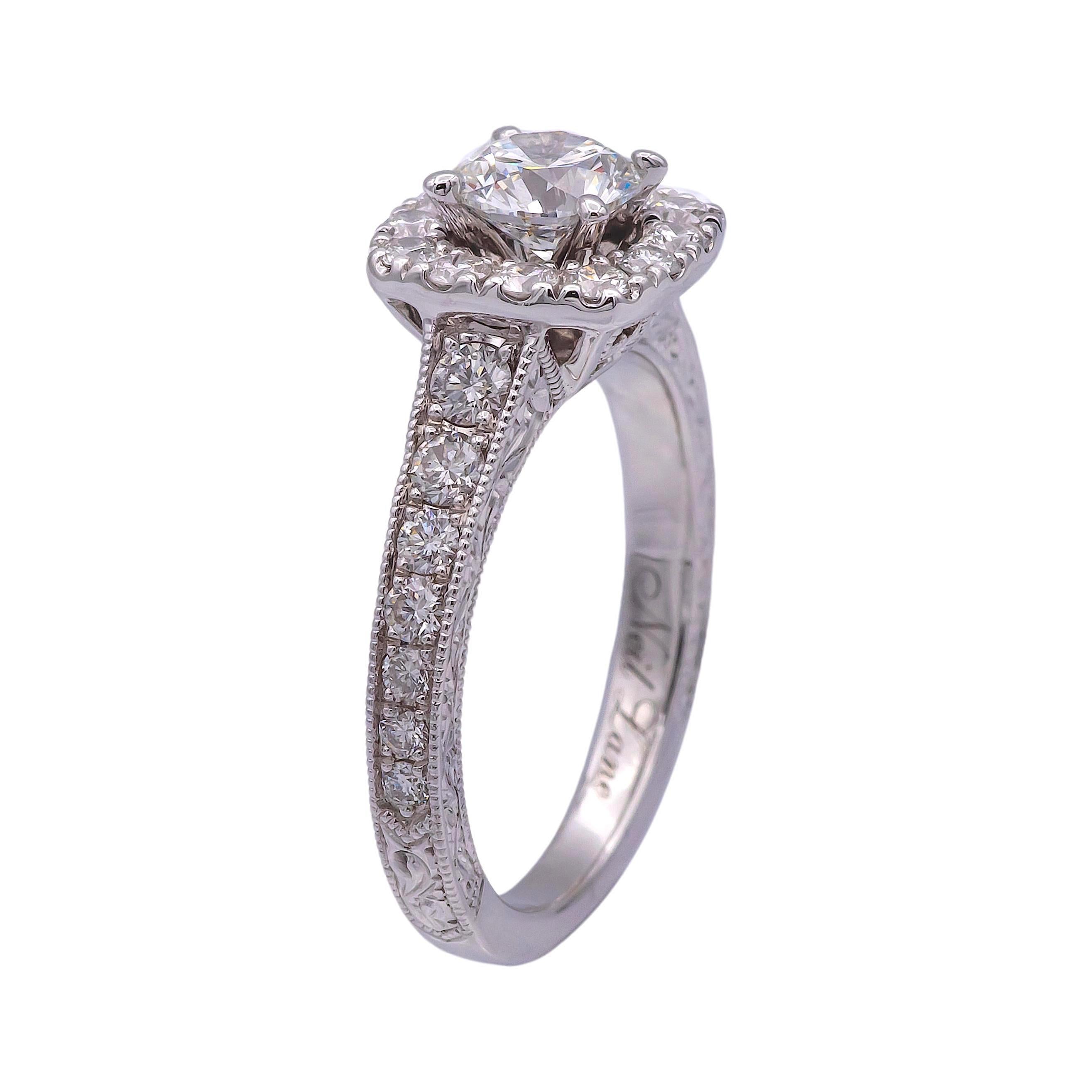 Diamond Engagement ring designed by Neil Lane finely crafted in 14 karat white gold featuring a round brilliant cut diamond center weighing 0.54 carats adorned by 1 row of bead set diamonds creating a cluster of diamonds that showcase brilliance and
