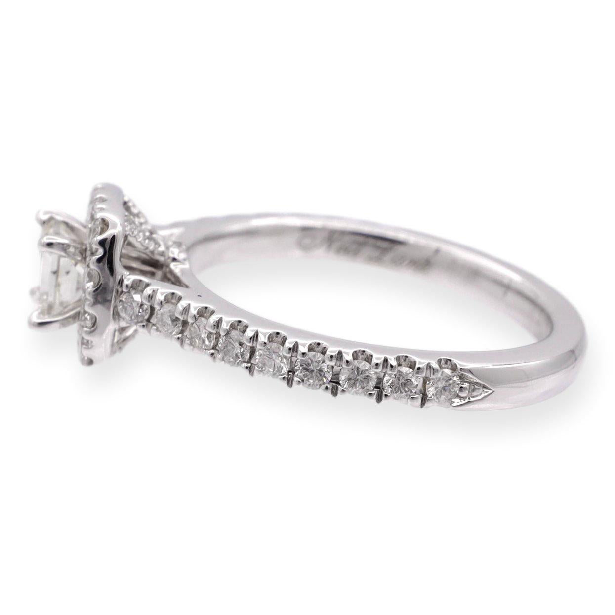 Diamond Engagement ring designed by Neil Lane finely crafted in 14 karat white gold featuring a princess cut diamond center weighing 0.26 carats approximately ranging I-J color, SI1-SI2 clarity adorned by 1 row of bead set diamonds creating a
