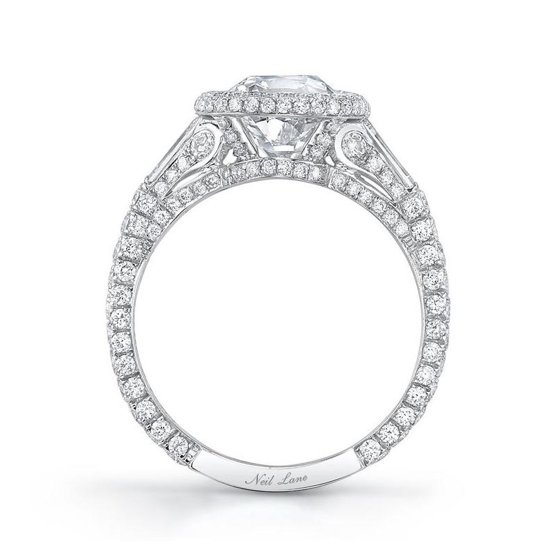 An enchanting handmade platinum Neil Lane ring centers upon a vintage cushion-cut diamond weighing 2.03 cts., G Color & VS1 Clarity.  Accented throughout by two baguette-cut diamonds weighing 0.45 ct. and 194 full-cut diamonds weighing 1.06