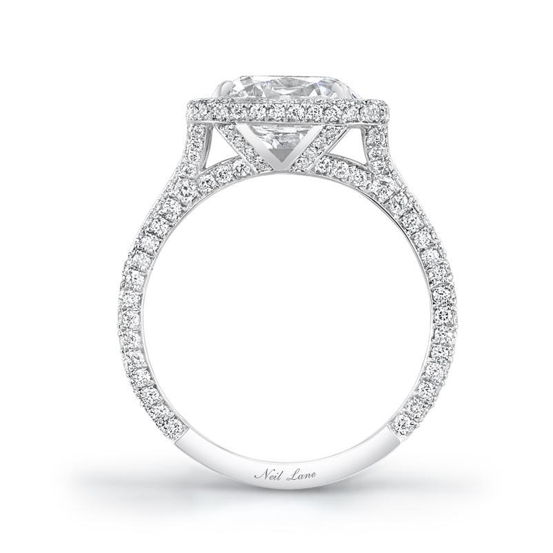 An impressive vintage style cushion-cut diamond with voluptuous facet angles weighing 3.02 cts with F color & SI1 clarity., is a perfect pairing with this Neil Lane designed handmade platinum mounting, architectural in design, embellished throughout