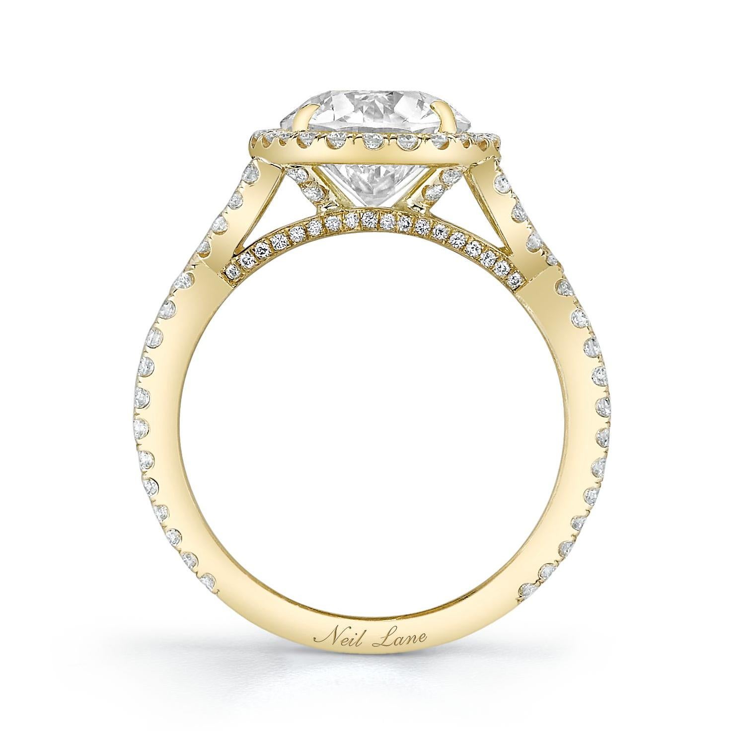 A vintage inspired ring, handmade in 18k yellow gold, features an Old European-Cut diamond weighing 2.15 cts., approximately K-L color & VS1-VS2 clarity, highlighted by one 132 round-cut diamonds weighing 0.86 ct.

Designed & signed by Neil Lane.