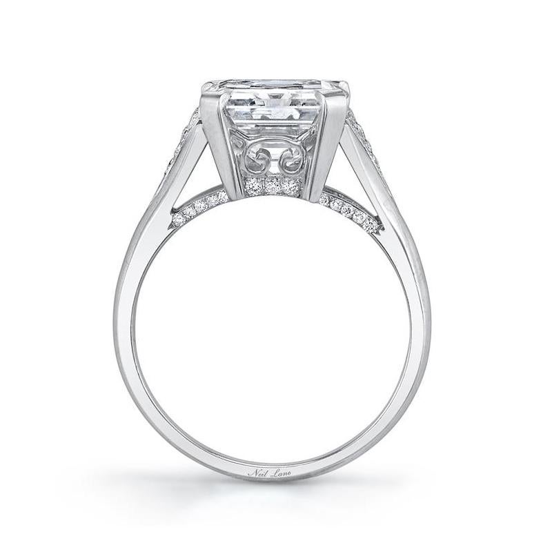 Elegant in its simplicity, this formidable emerald-cut diamond weighs 3.57 cts., I Color & VS1 Clarity, forty round-cut diamonds complete the ring with subtle accents, handmade in platinum.

Designed & signed by Neil Lane.