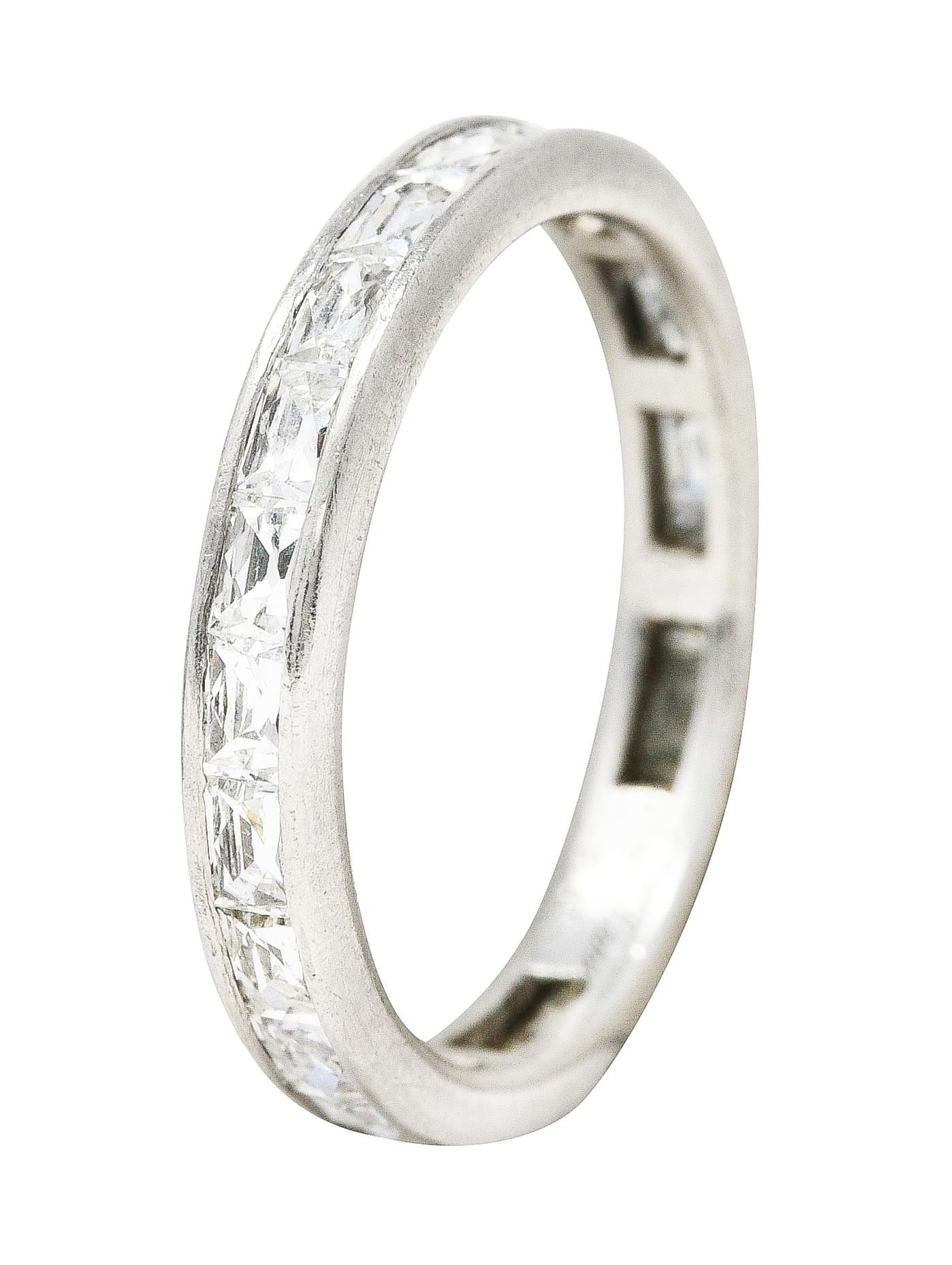 Ring features elongated French cut diamonds channel set fully around. Weighing approximately 2.05 carat total - G color with VS clarity. With high polished platinum finish. Stamped plat for platinum. Fully signed Neil Lane. Circa: 21st century. Ring
