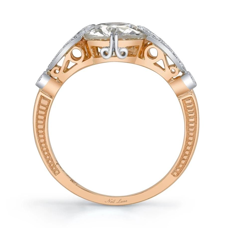 Designed by Neil Lane, this handmade ring is a harmonious blend of 18k rose gold and platinum, presenting an Old European-cut diamond weighing 1.53 cts., accented by six full-cut diamonds,

Designed & signed by Neil Lane.