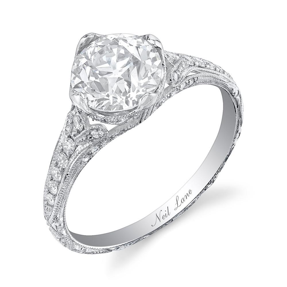 The handmade ring highlights an Old European cut diamond weighing 1.66 cts, VVS2 Clarity & J Color, mounted in finely millegrained platinum decorated by fifty-six full-cut diamonds weighing 0.25 ct.

Designed & signed by Neil Lane.