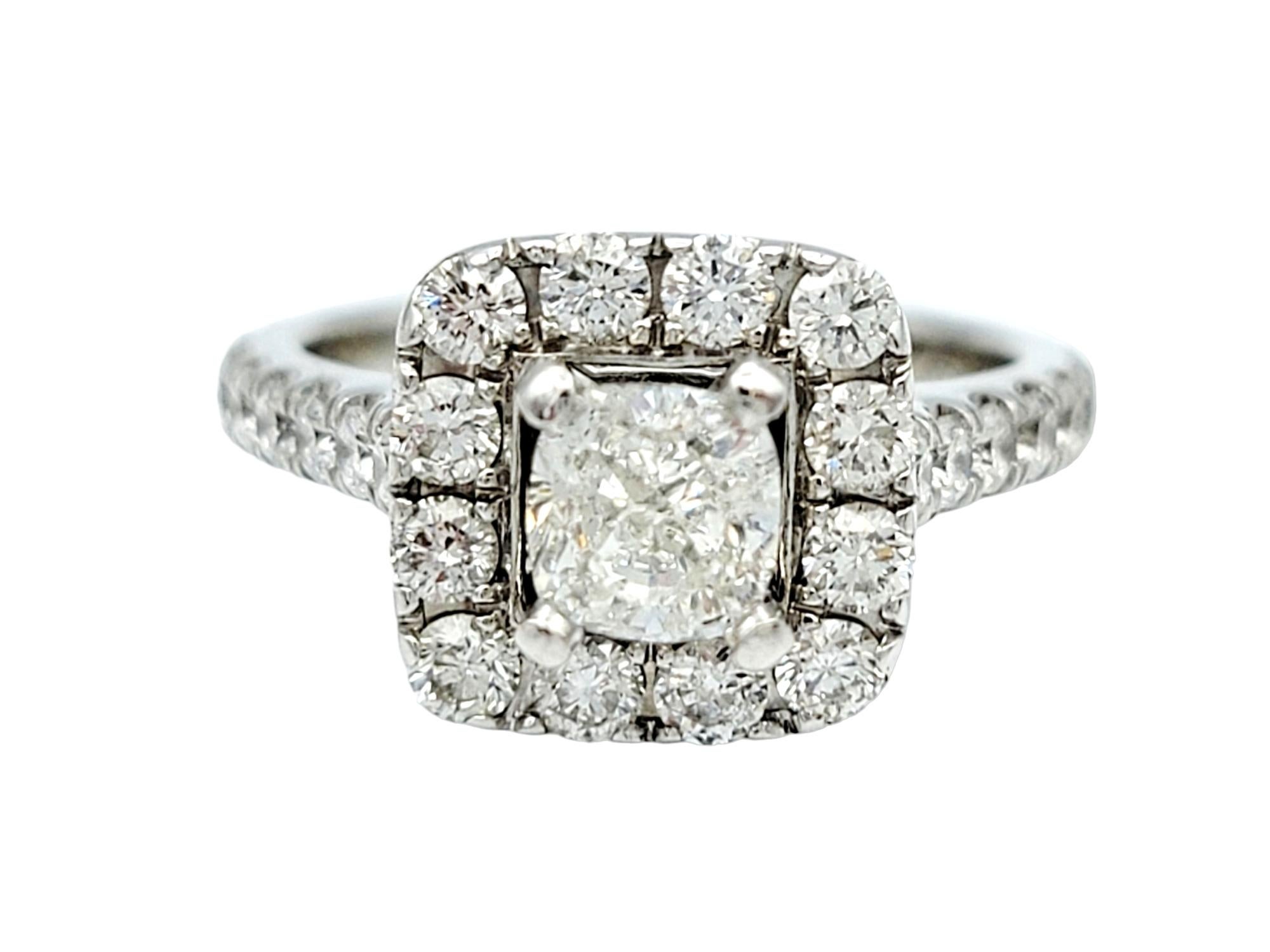 Ring size 4.75

This gorgeous Neil Lane engagement ring is a breathtaking masterpiece that encapsulates the essence of timeless romance and luxurious sophistication. At its heart, a dazzling cushion-cut diamond takes center stage, radiating with