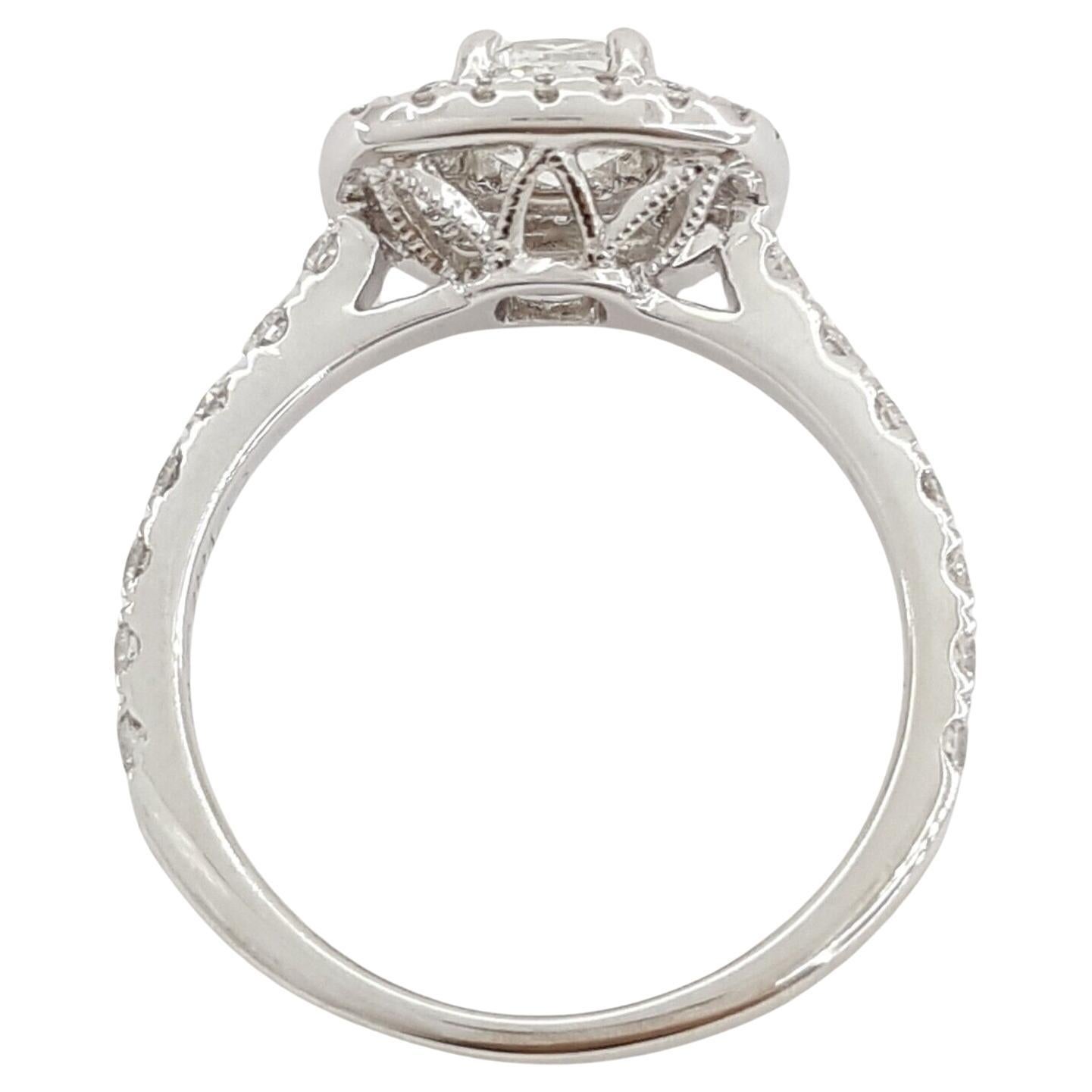  Neil Lane Bridal ® Collection, this 14k white gold engagement ring features a total weight of 1.20 carats, adorned with a captivating Cushion Brilliant Cut diamond in a double halo design.

Weighing 3.2 grams and sized at 5.25, the ring boasts a