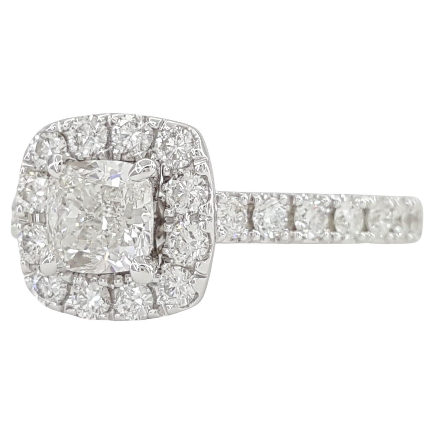 Neil Lane Bridal® Collection, a stunning 1.38-carat total weight engagement ring featuring a Cushion Cut diamond halo set in 14k White Gold.

This exquisite ring weighs 4.5 grams and is sized at 6.75. The centerpiece is a natural Cushion Brilliant
