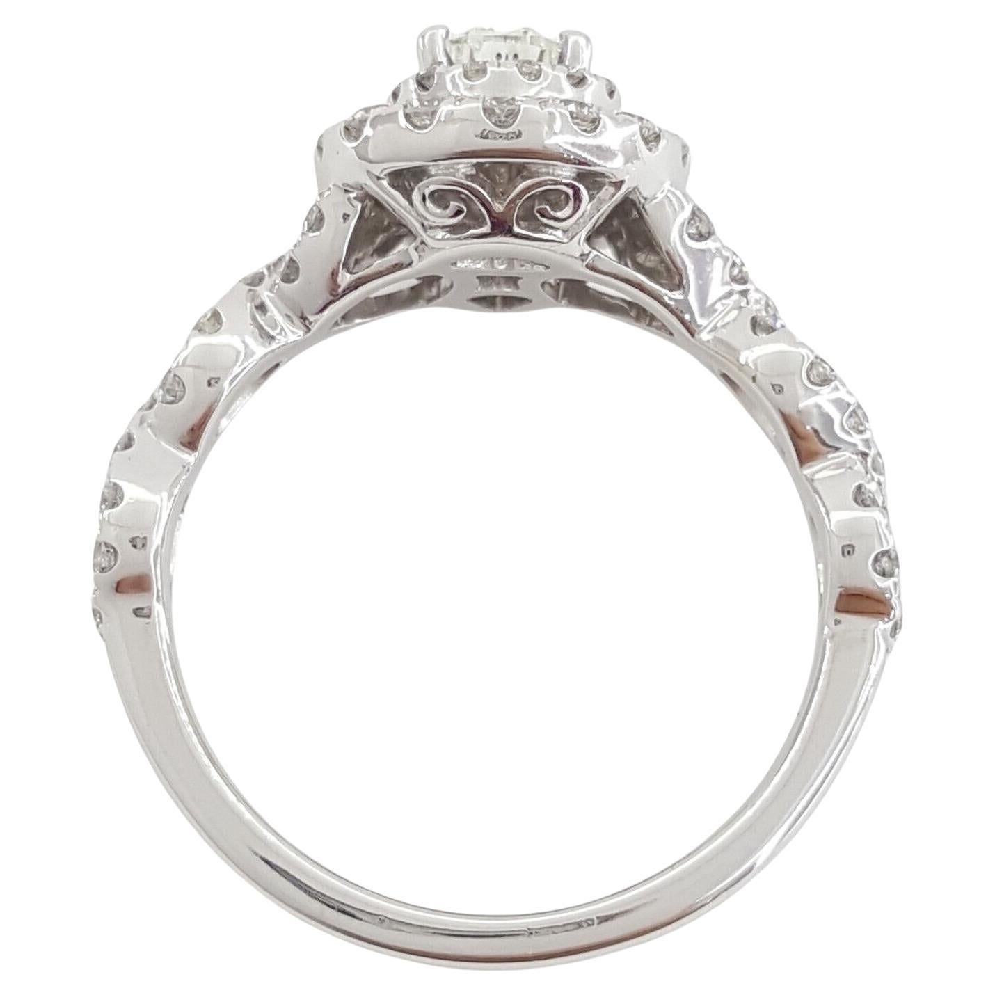 Neil Lane Bridal® Collection, an exquisite engagement ring in 14k white gold, featuring a total diamond weight of 1.14 carats. Weighing 4.2 grams and sized at 6.5, this captivating ring showcases a natural Pear Brilliant Cut center diamond,