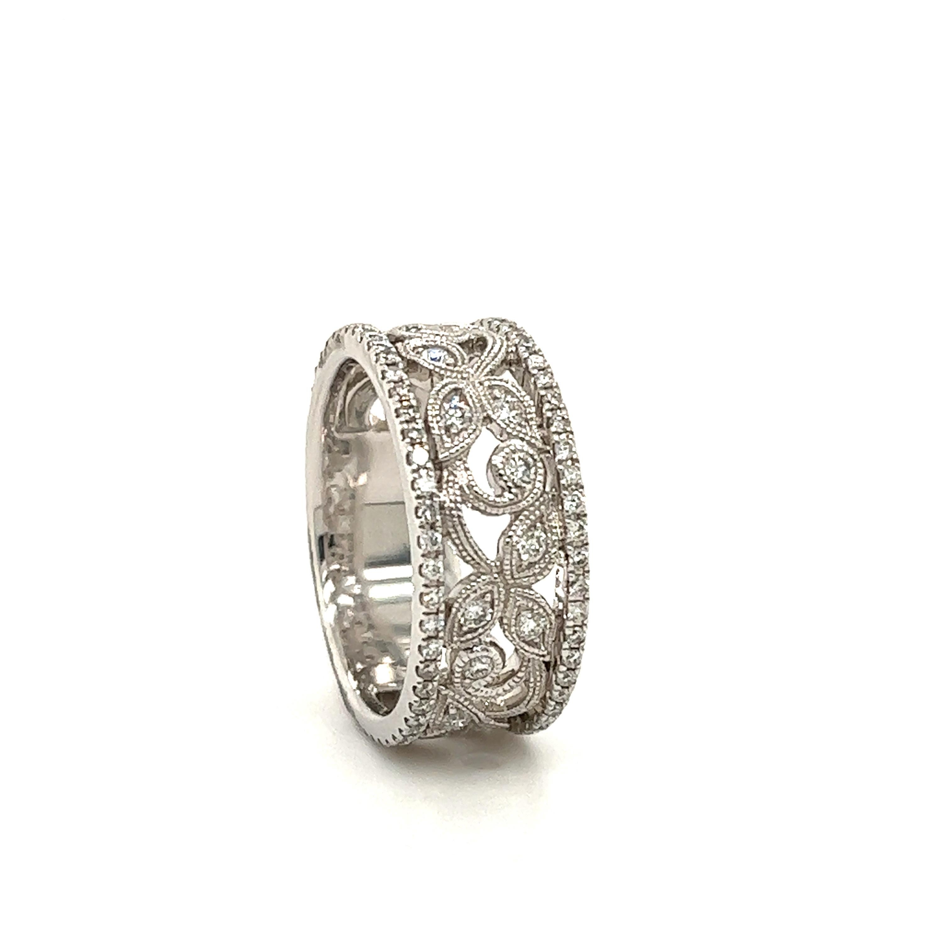 Beautiful ring crafted in 14k white gold. The ring is crafted by famed designer Neil Lane. The ring is a wide band design as it measures 8.6 mm in width. Neil Lane is known for his bridal designs and fine crafted rings with a delicate vintage feel.