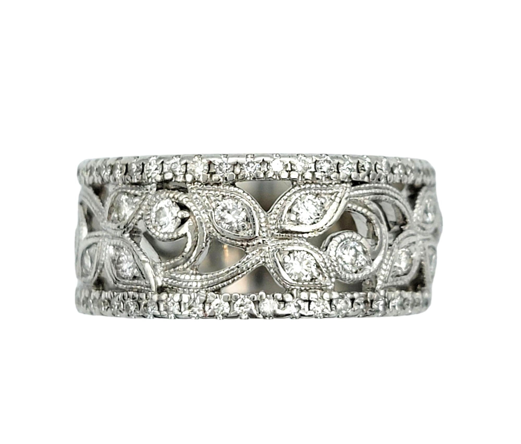 Ring Size: 6.5

Crafted by the renowned designer, Neil Lane, this exquisite diamond band ring showcases a delicate yet captivating design in lustrous 14 karat white gold. The band features a whimsical cut-out leaf motif, adding a touch of