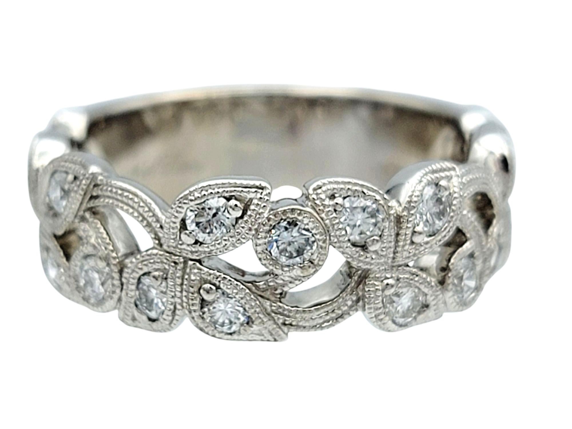 Ring Size: 6.25

This authentic Neil Lane ring is designed in a romantic filigree vine motif, delicately crafted in 14 karat white gold. Seventeen round brilliant cut diamonds are intricately placed throughout the curling leaf-like forms, adding a