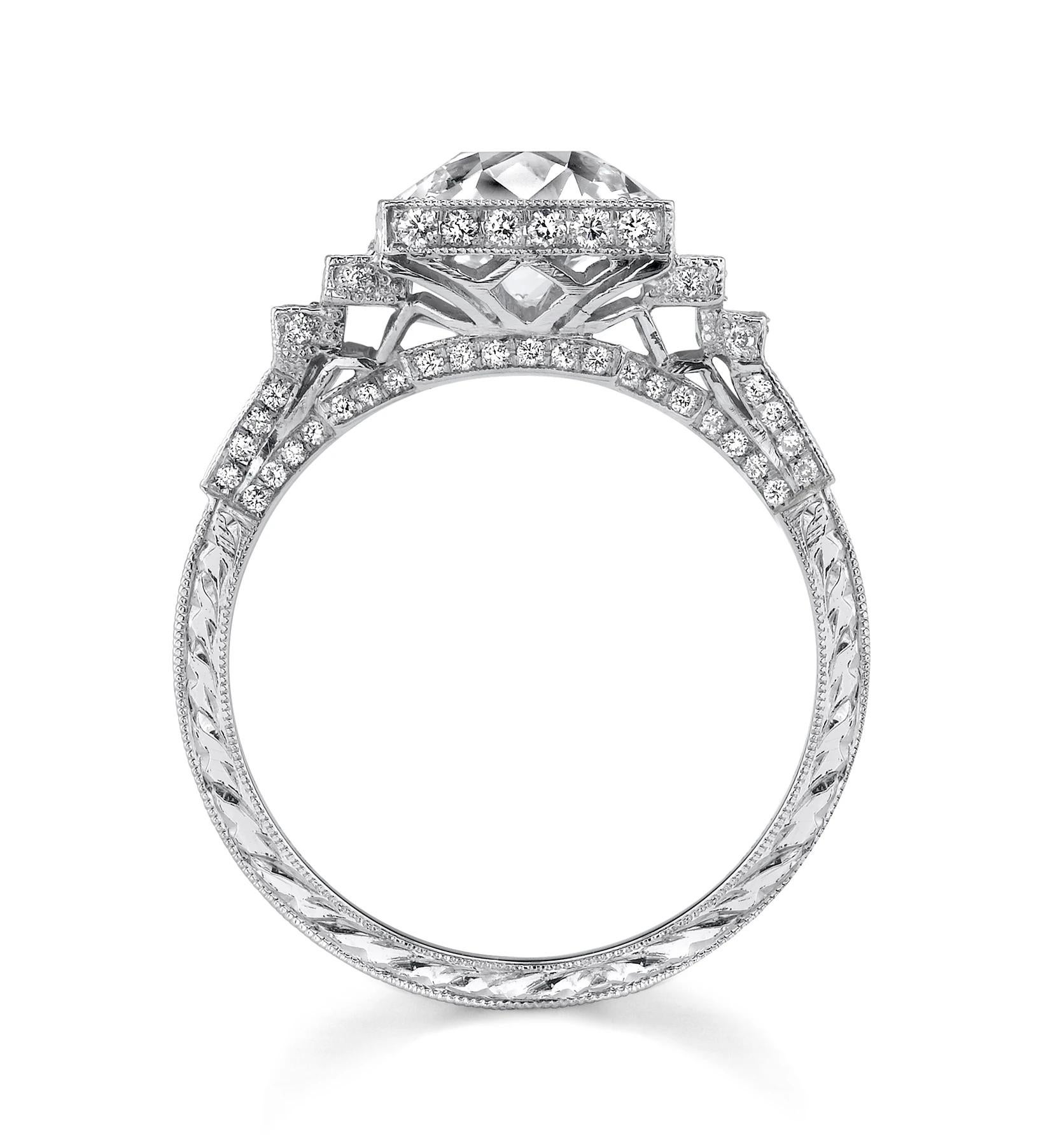 Architectural in design, this Neil Lane ring features an Old European-cut diamond weighing 1.80 cts., D Color and VS2 Clarity, cascading into finely millegrained platinum sections set throughout with one hundred full-cut diamonds weighing 0.49 ct.,