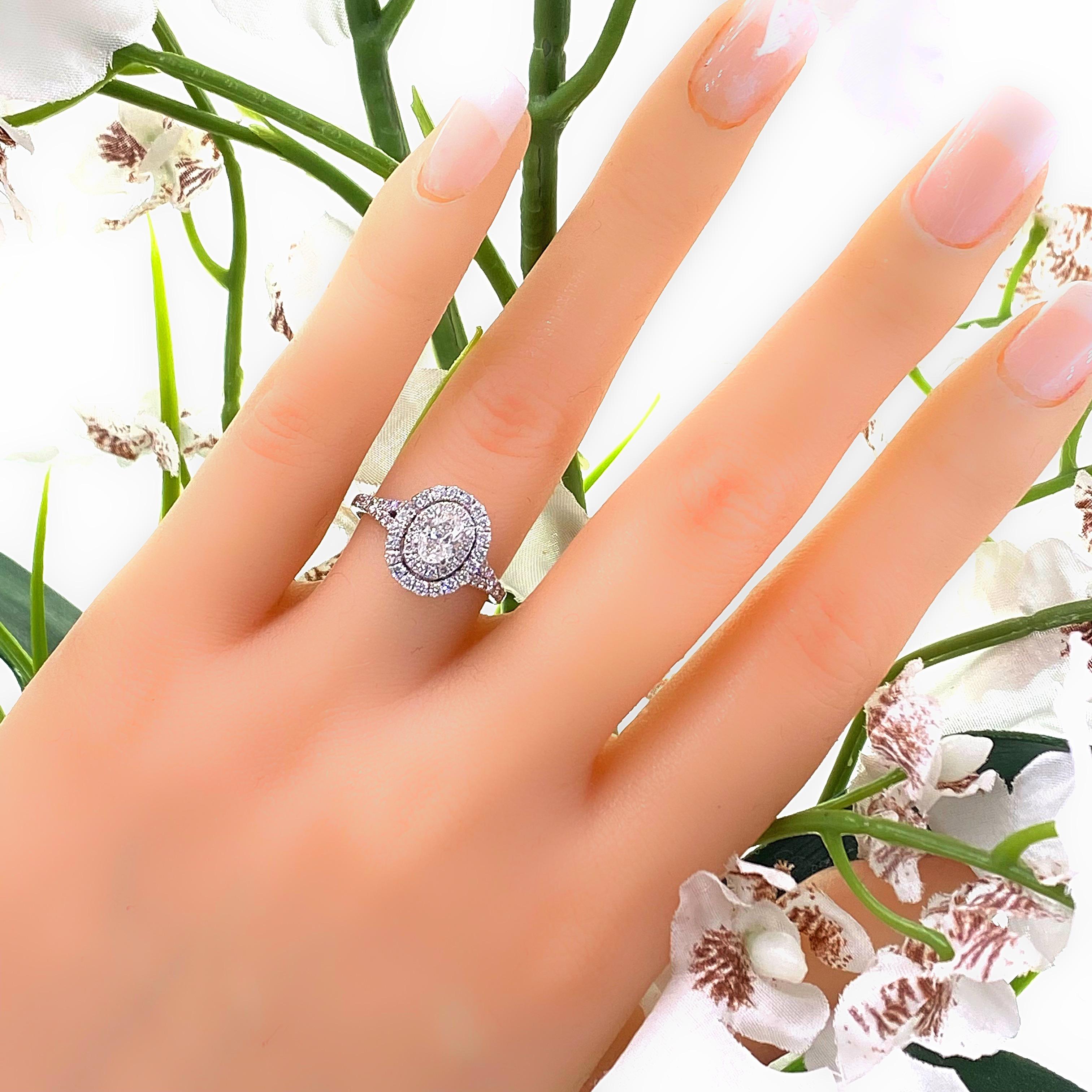 Neil Lane Bridal Double Halo Oval Diamond Engagement Ring
Style:  Halo
Metal:  14kt White Gold
Size:  6 - sizable
TCW:  1.00 tcw
Main Diamond:  Oval Diamond 0.50 cts
Color & Clarity:  I, I1
Accent Diamonds:   62 Round Brilliant Diamonds 0.50