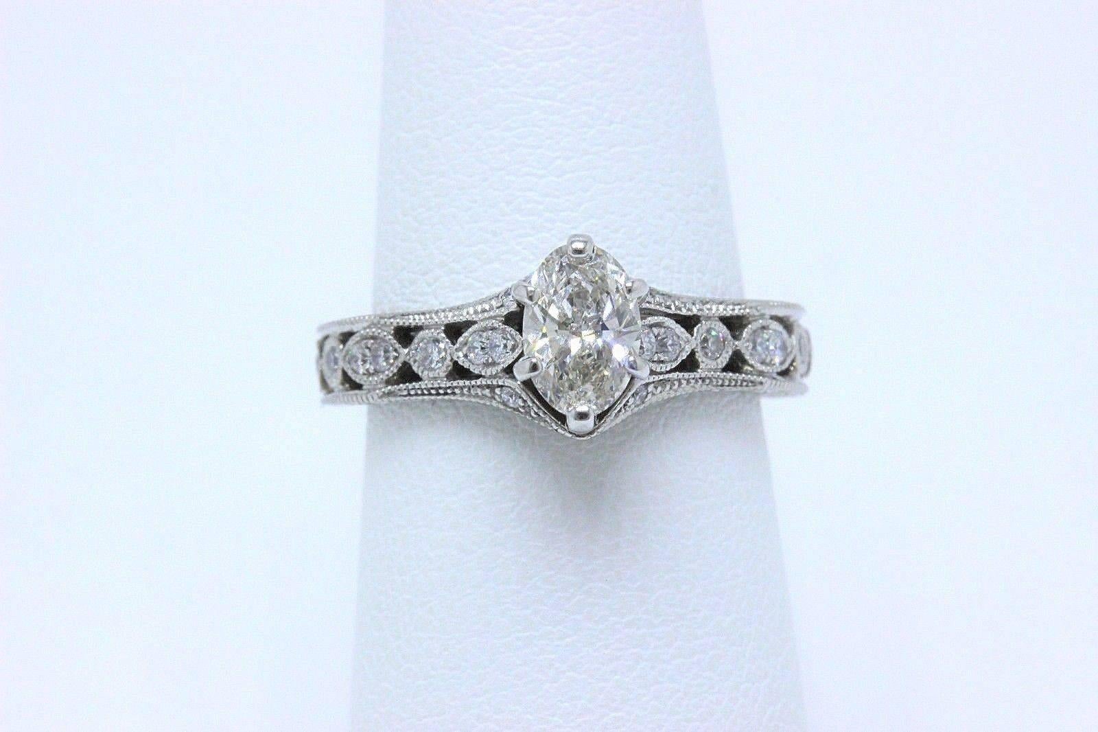 NEIL LANE ENGAGEMENT RING 3/4 TCW DIAMONDS 
Style:  Solitaire With Accent Diamonds with Milgrain Band
SKU Number:  940201510
Metal:  14KT White Gold
Size:  5.5 - Sizable
Total Carat Weight:  3/4 TCW
Diamond Shape:  Marquise Diamond 0.56 CTS 
Diamond