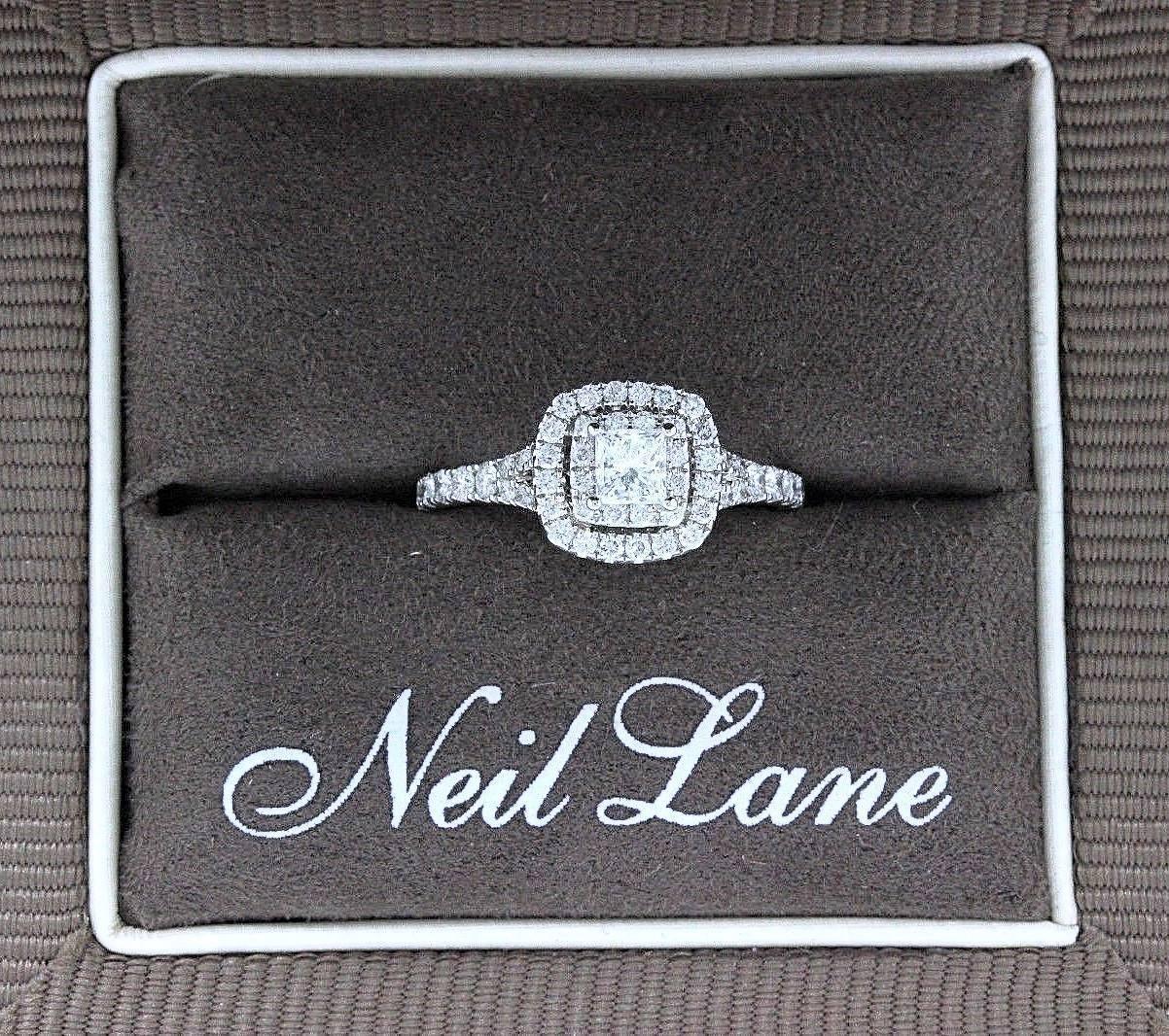 NEIL LANE BRIDAL COLLECTION
Style:  Double Halo Pave Diamond Engagement Ring
Item Number:  940241514
Metal:  14k White Gold
Size:  6.5 - Sizable
Total Carat Weight:  1.00 TCW
Center Diamond Shape:  Round Diamond 0.33 CTS
Diamond Color & Clarity:  I