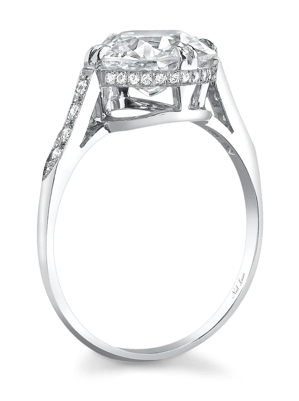 Elegantly set in platinum, the ring centers upon one round brilliant-cut diamond weighing 3.01 cts., accented throughout the gallery and shoulders by thirty-eight round-cut diamonds weighing 0.14 ct., handmade in platinum. stating H Color & VS2