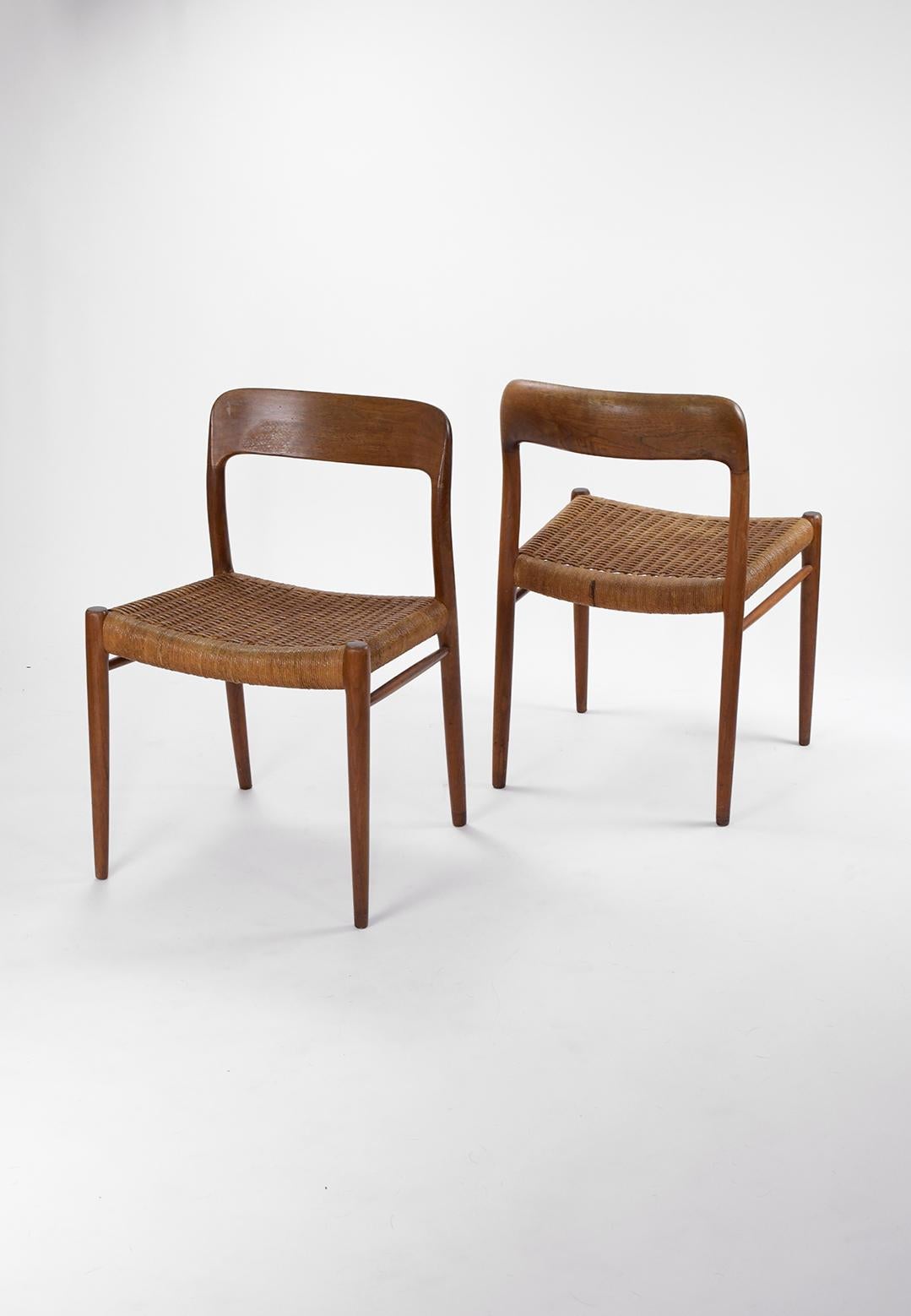 This iconic pair of Model 77 dining chairs designed by Neils Moller and produced by J.L. Møllers Møbelfabrik in the 1960´s. This model chair from Moller has been viewed as a showcase of his commitment to timeless design and craftsmanship. The chairs