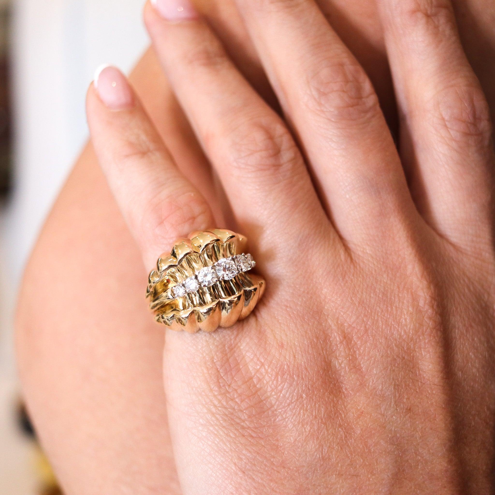 Retro modernist ring by Neiman Marcus & Co.

Great statement cocktail ring, created during the retro-modernist period back in the 1950. The ring has been designed in a bombe-scalloped shape and crafted in solid yellow gold of 18 karats with a part