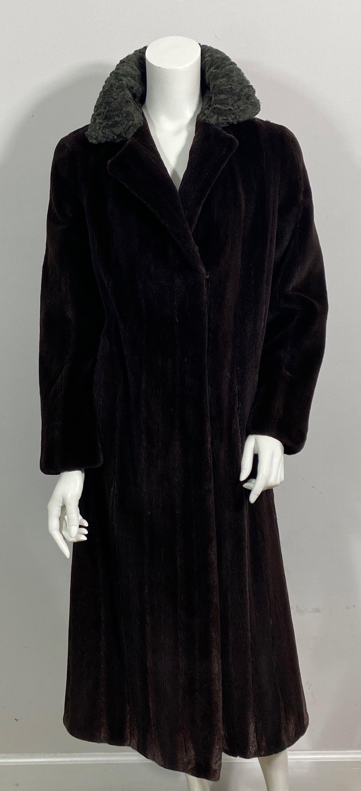 Neiman Marcus Chocolate Brown Sheared Beaver Long Coat - Size Medium This beautiful rich chocolate brown sheared beaver long coat has a lighter brown Persian lamb 4” collar which can be worn down or up along the back. The coat has 1 top exterior