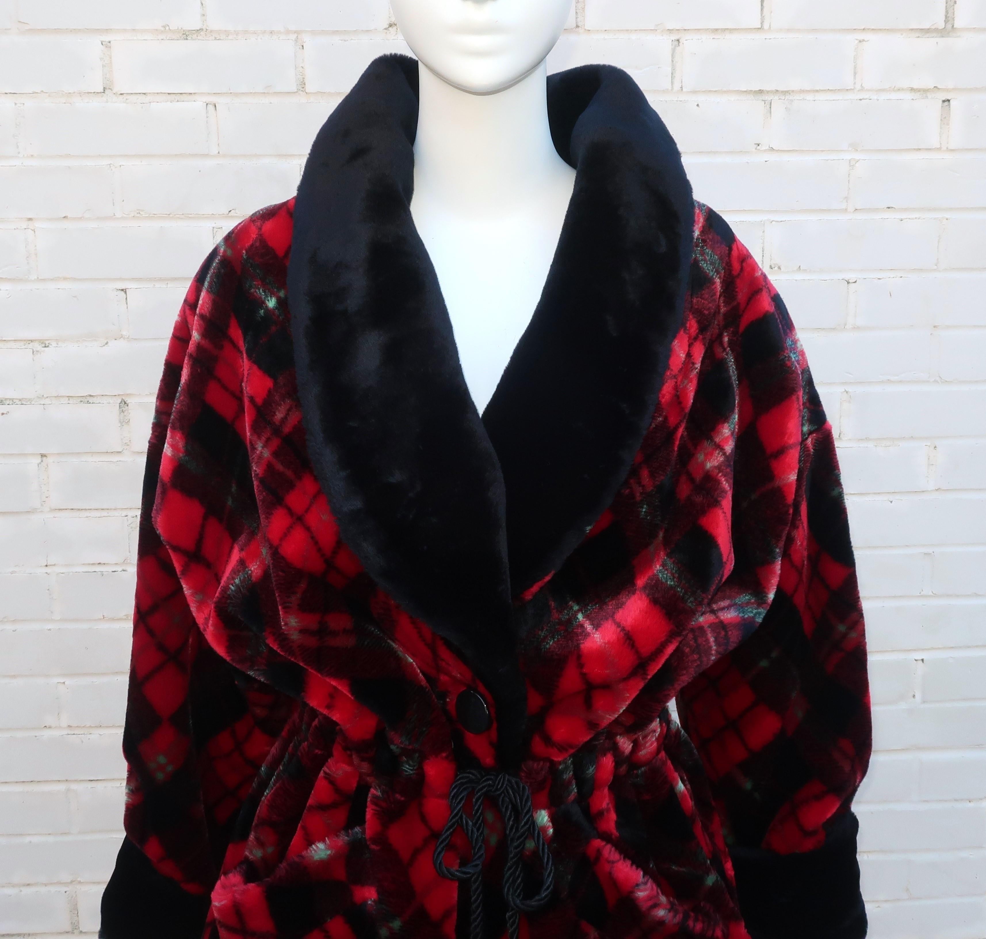 Cozy up with a 1980's Neiman Marcus faux fur smoking jacket in black and red tartan print with the hint of bright green highlights.  The jacket buttons at the front with a silk cord drawstring waist and toggles.  It has generous front pockets,