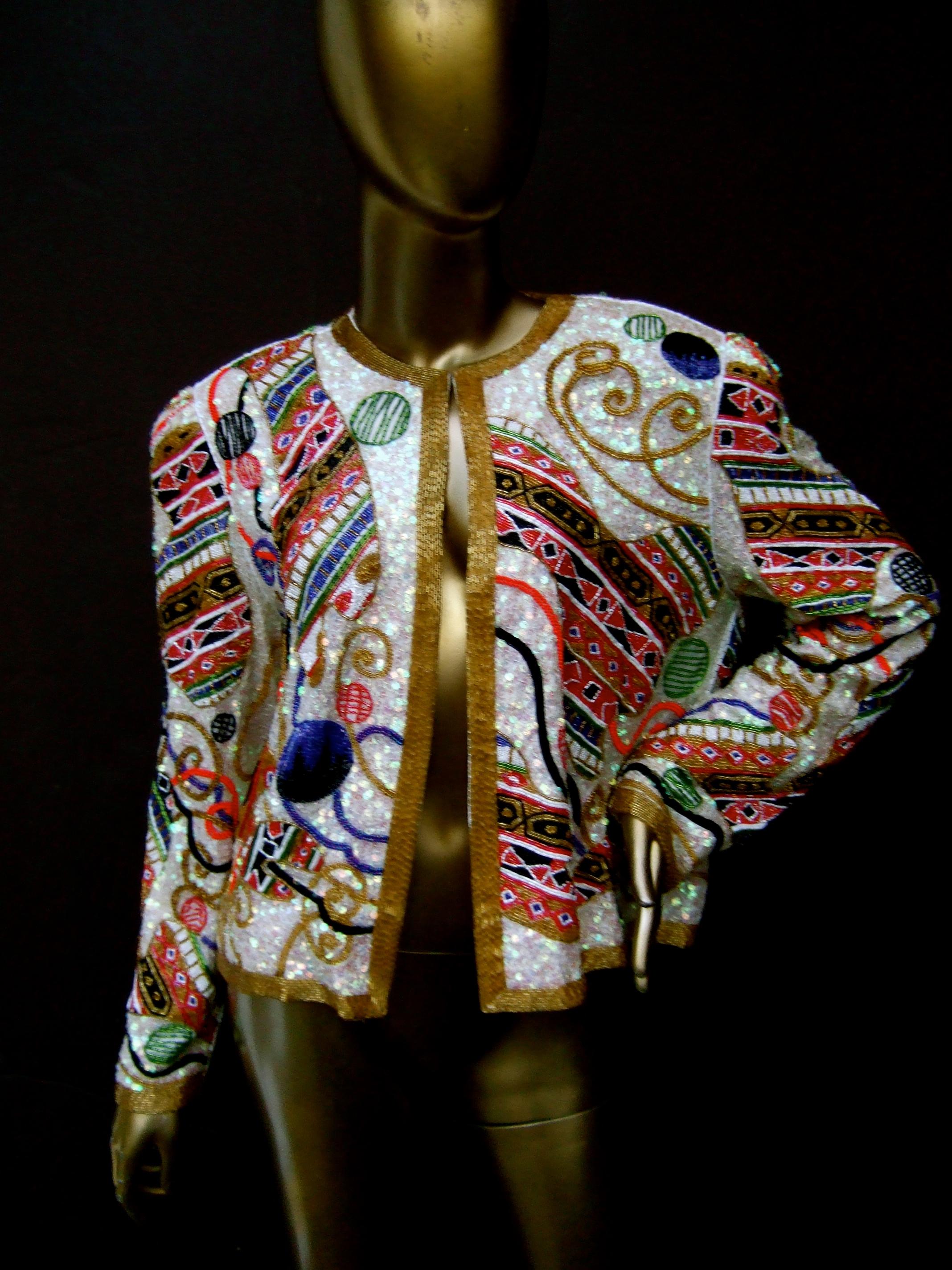 Neiman Marcus Exquisite glass silk beaded & sequined evening jacket c 1980s
The silk lined jacket is substantial in weight with the collection of contiguous
glass beaded and sequined embellishments throughout

Accented with rows of golden bugle