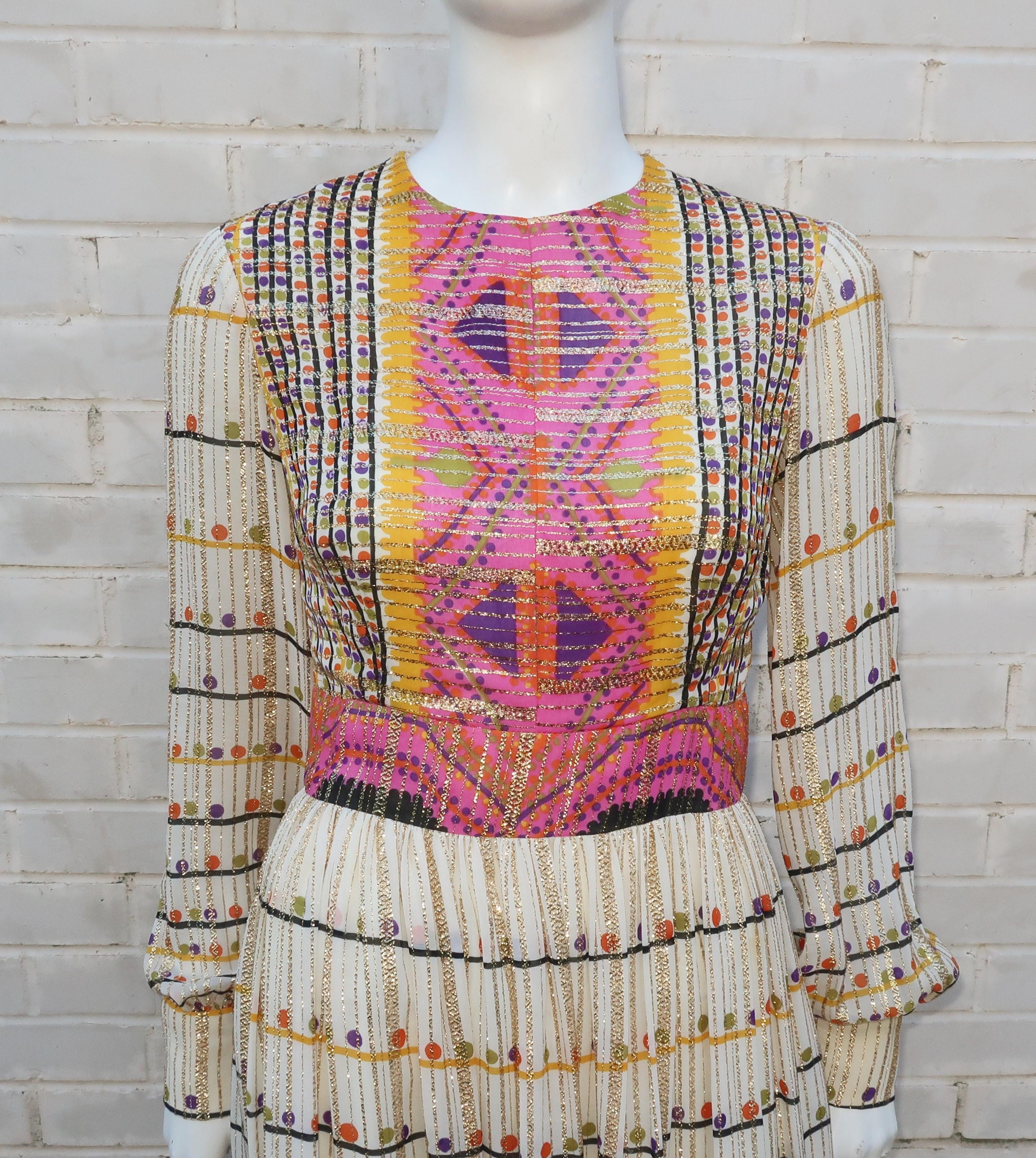 Mod, maxi and marvelous!  This 1960's Neiman Marcus label gold lamé dress is designed with an eye catching geometric print fabric in bright shades of hot pink, purple, yellow, olive green and black.  It zips and hooks at the back with blousy sleeves