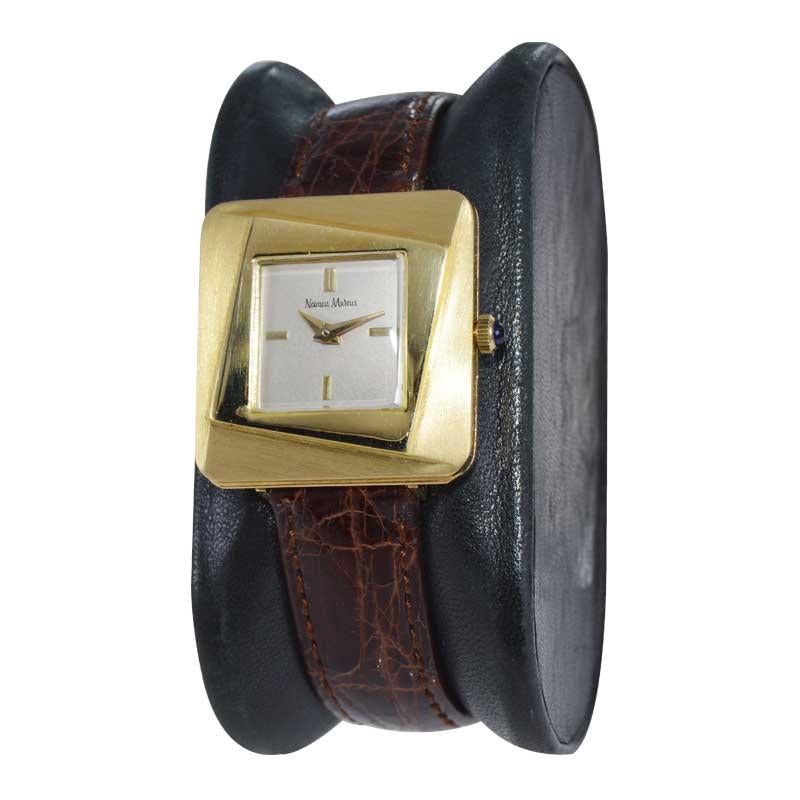 FACTORY / HOUSE: Neiman Marcus 
STYLE / REFERENCE: Mid Century 
METAL / MATERIAL: 18kt Yellow Gold
CIRCA / YEAR: 1960's
DIMENSIONS / SIZE: Length 28mm x Width 26mm
MOVEMENT / CALIBER: Manual Winding / 17 Jewels 
DIAL / HANDS: Original Silvered with