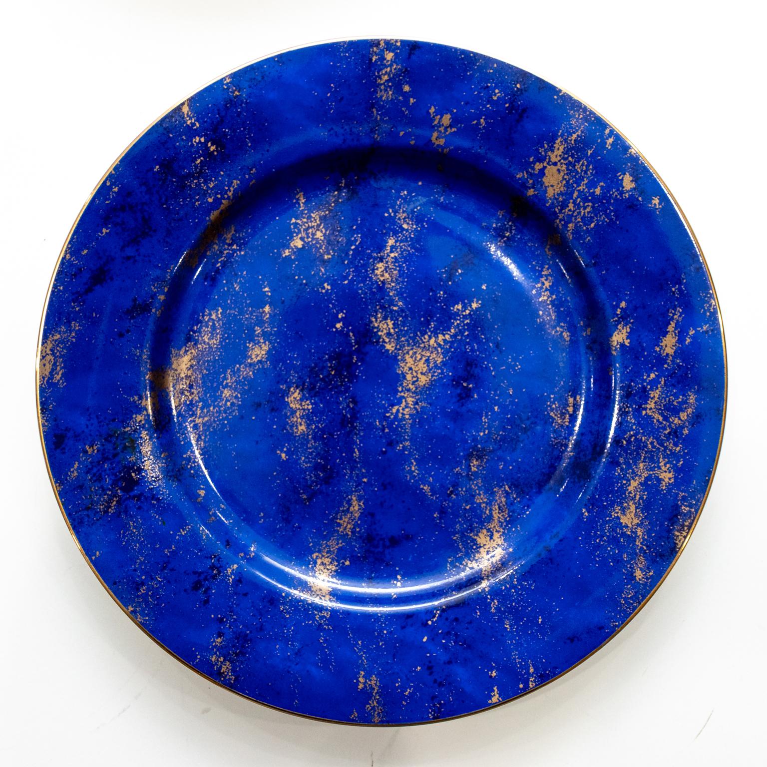 Circa mid-20th century Contemporary style set of ten Neiman Marcus vintage large blue chargers or dinner plates in porcelain with gold. Made in the United States. Please note of wear consistent with age. No chips and no knife marks.