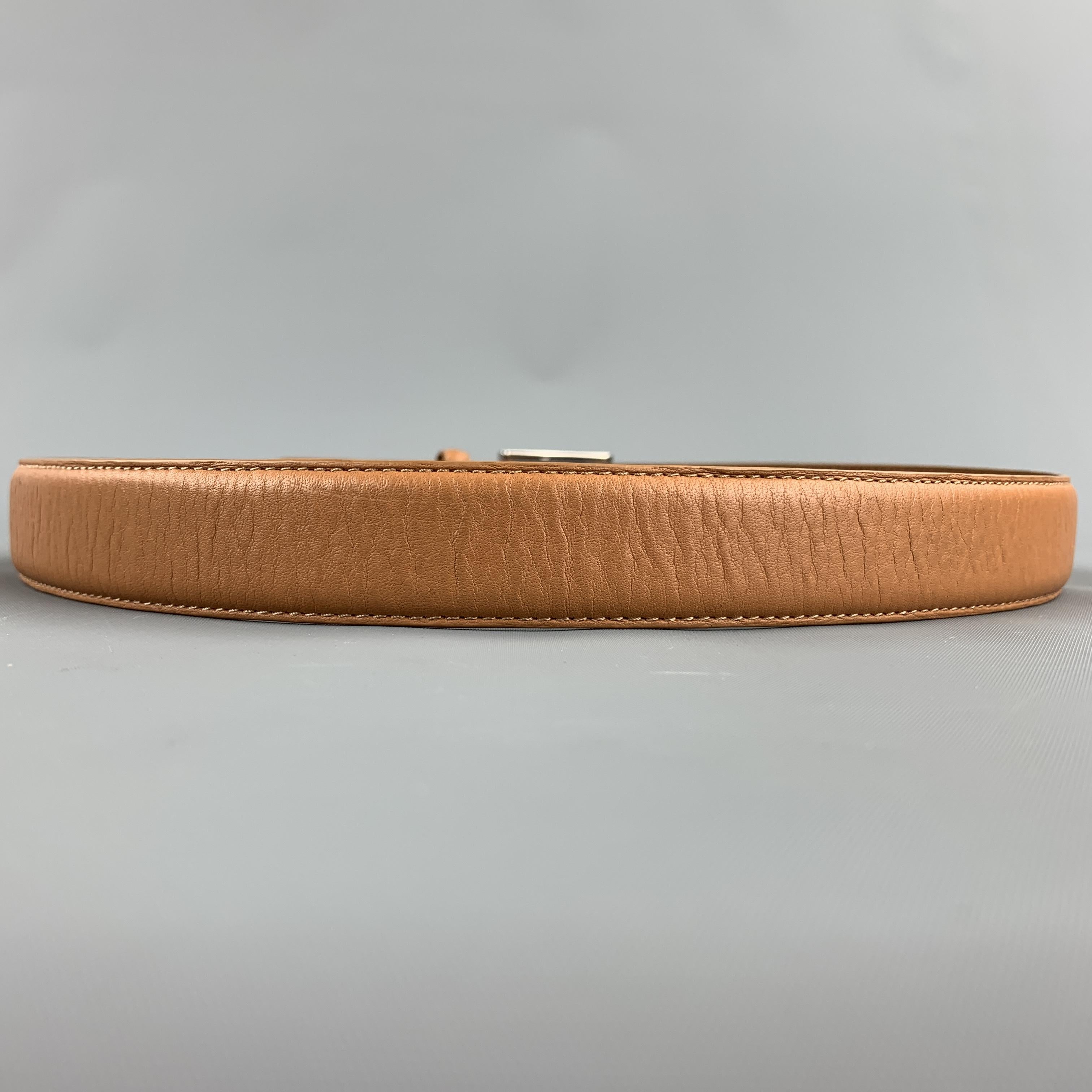 NEIMAN MARCUS belt comes in a tan leather featuring a silver tone buckle.

Good Pre-Owned Condition.
Marked: 32

Length: 39 in. 
Width: 1 in. 
Min Fit: 31.5 in. 
Max Fit: 35.5 in. 