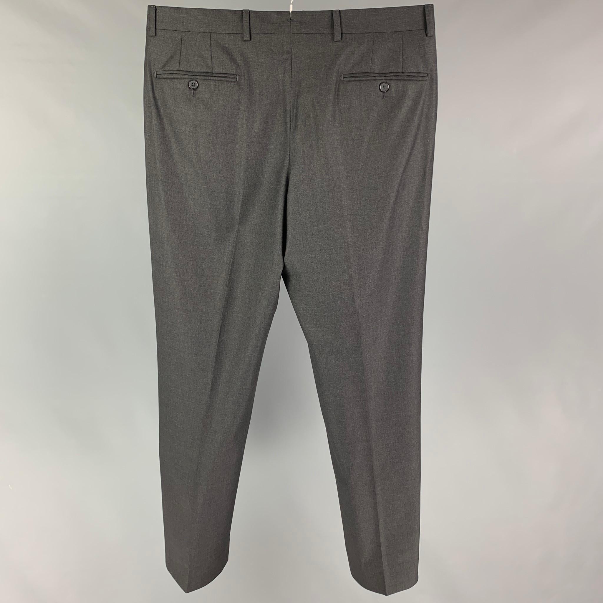 NEIMAN MARCUS dress pants comes in a grey wool by Loro Piana featuring a flat front, zip fly, and a double button closure. 

Very Good Pre-Owned Condition.
Marked: 34

Measurements:

Waist: 36 in.
Rise: 11 in.
Inseam: 32 in. 
