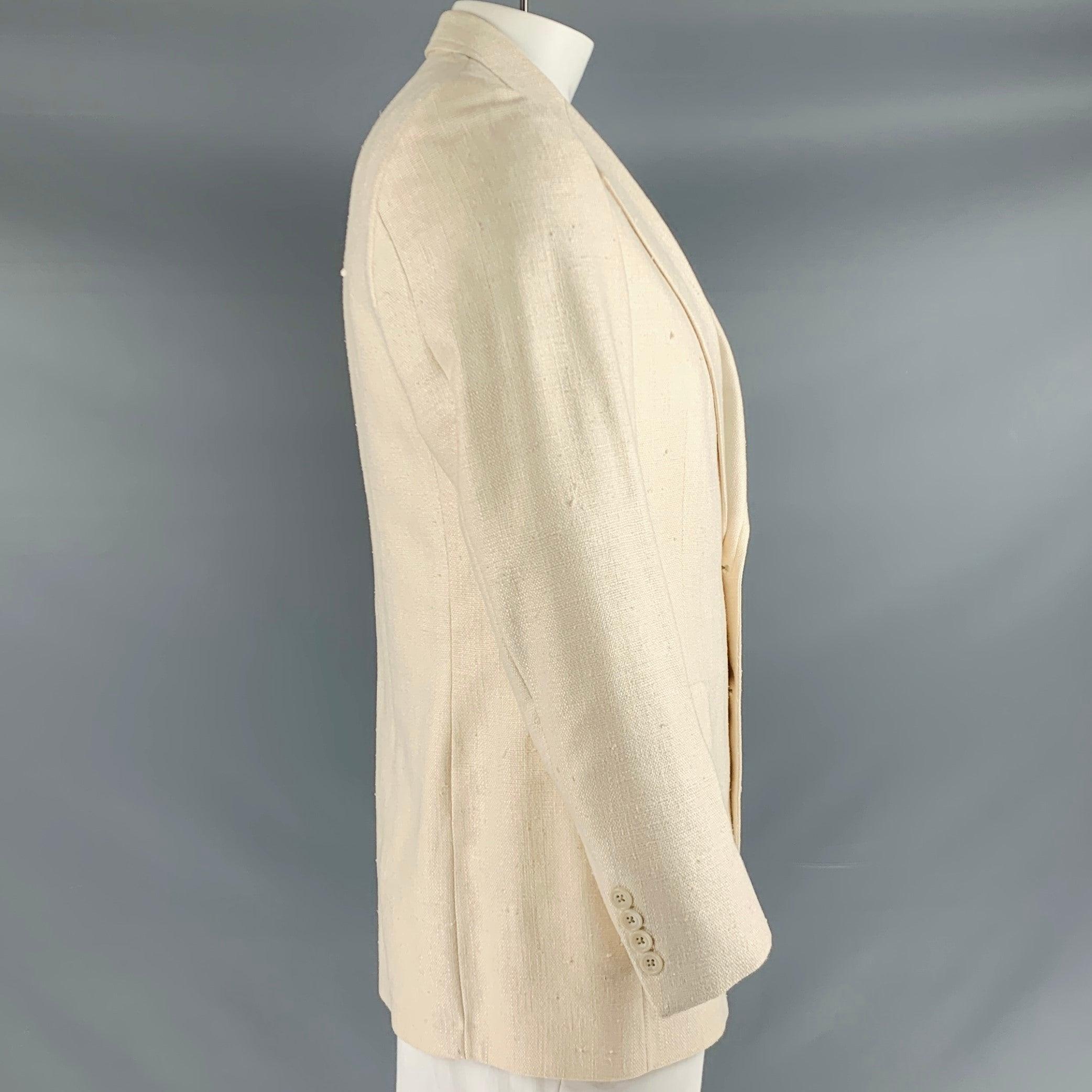 NEIMAN MARCUS sport coat
in a beige silk fabric featuring a textured woven style, notch lapel, single vented back, and double button closure. Made in USA.Very Good Pre-Owned Condition. Moderate signs of wear. 

Marked:   size not marked.