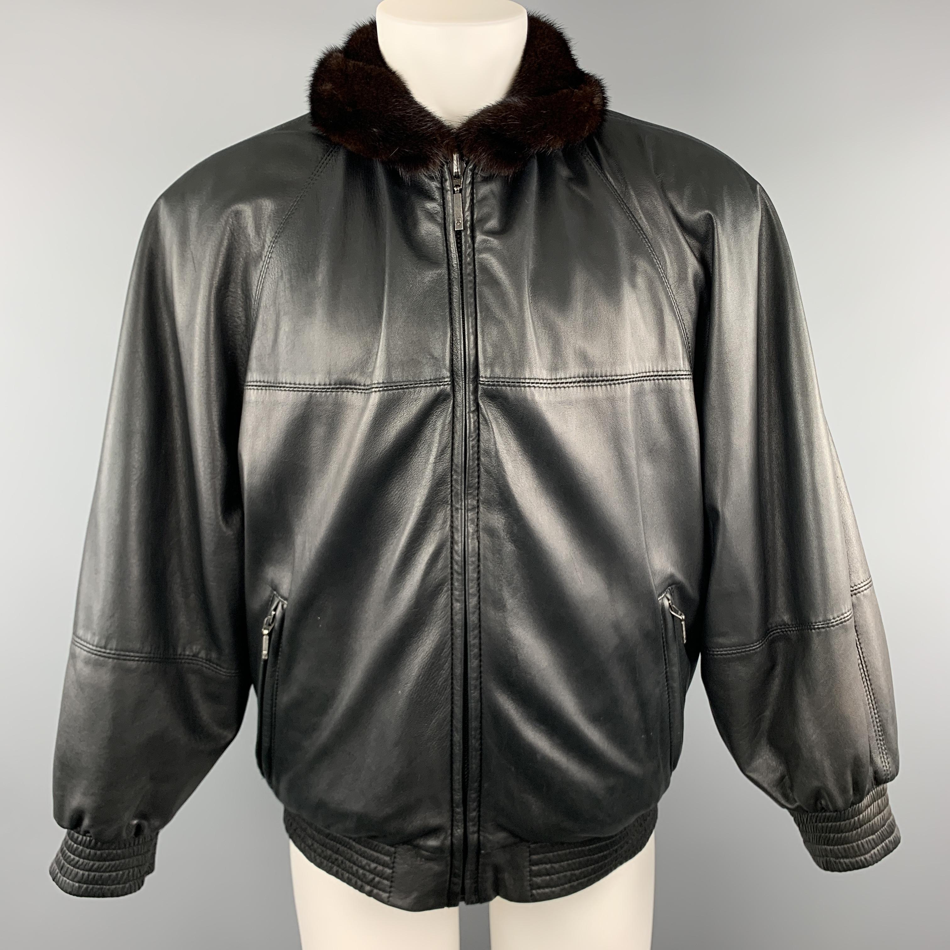 Vintage NEIMEN MARCUS reversible bomber jacket comes in brown fur with a folded collar, zip front and pockets, and reverse black leather side. 

Excellent Pre-Owned Condition.
Marked: (no size)

Measurements:

Shoulder: 18 in.
Chest: 50 in.
Sleeve: