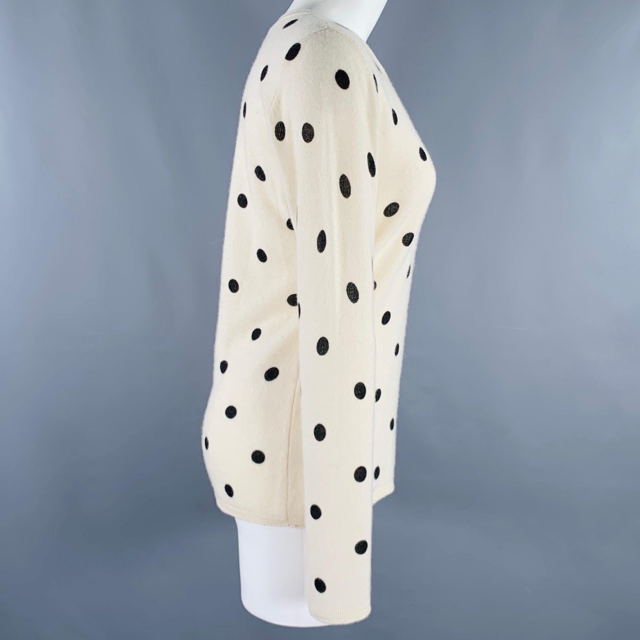 NEIMAN MARCUS pullover
in a beige cashmere knit featuring a black polka dot pattern, long sleeves, and crew neck.Very Good Pre-Owned Condition. Minor pilling. 

Marked:   size not marked 

Measurements: 
 
Shoulder: 16 inches Bust: 38 inches Sleeve: