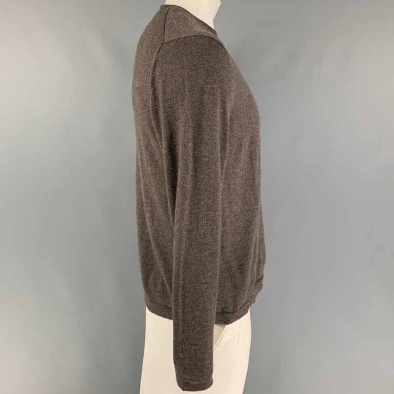 NEIMAN MARCUS pullover comes in a brown cashmere featuring a crew-neck. 

Very Good Pre-Owned Condition.
Marked: XL

Measurements:

Shoulder: 19 in.
Chest: 44 in.
Sleeve: 26.5 in.
Length: 26.5 in. 