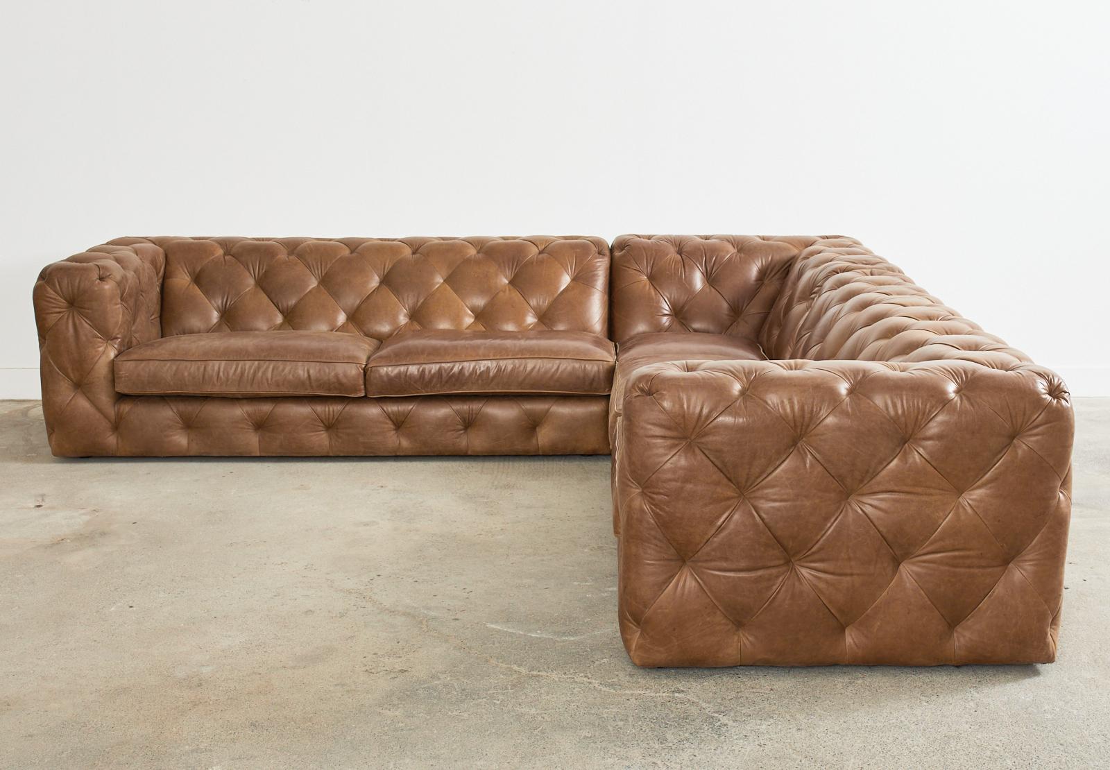 Grand English chesterfield style sectional sofa hand-crafted by Bernhardt for Neiman-Marcus. This rare artisan made sofa features a hardwood frame with mortise and tenon construction covered with beautifully aged and intentionally distressed tufted