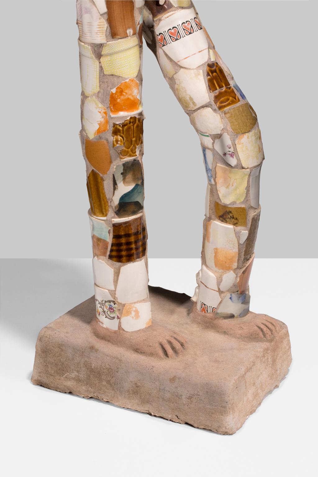 This mixed media standing figure is an outstanding example of the work of Indian artist Nek Chand. Made of various materials strew about our world, Chand constructions a three-dimensional man from the things we leave behind and the things we