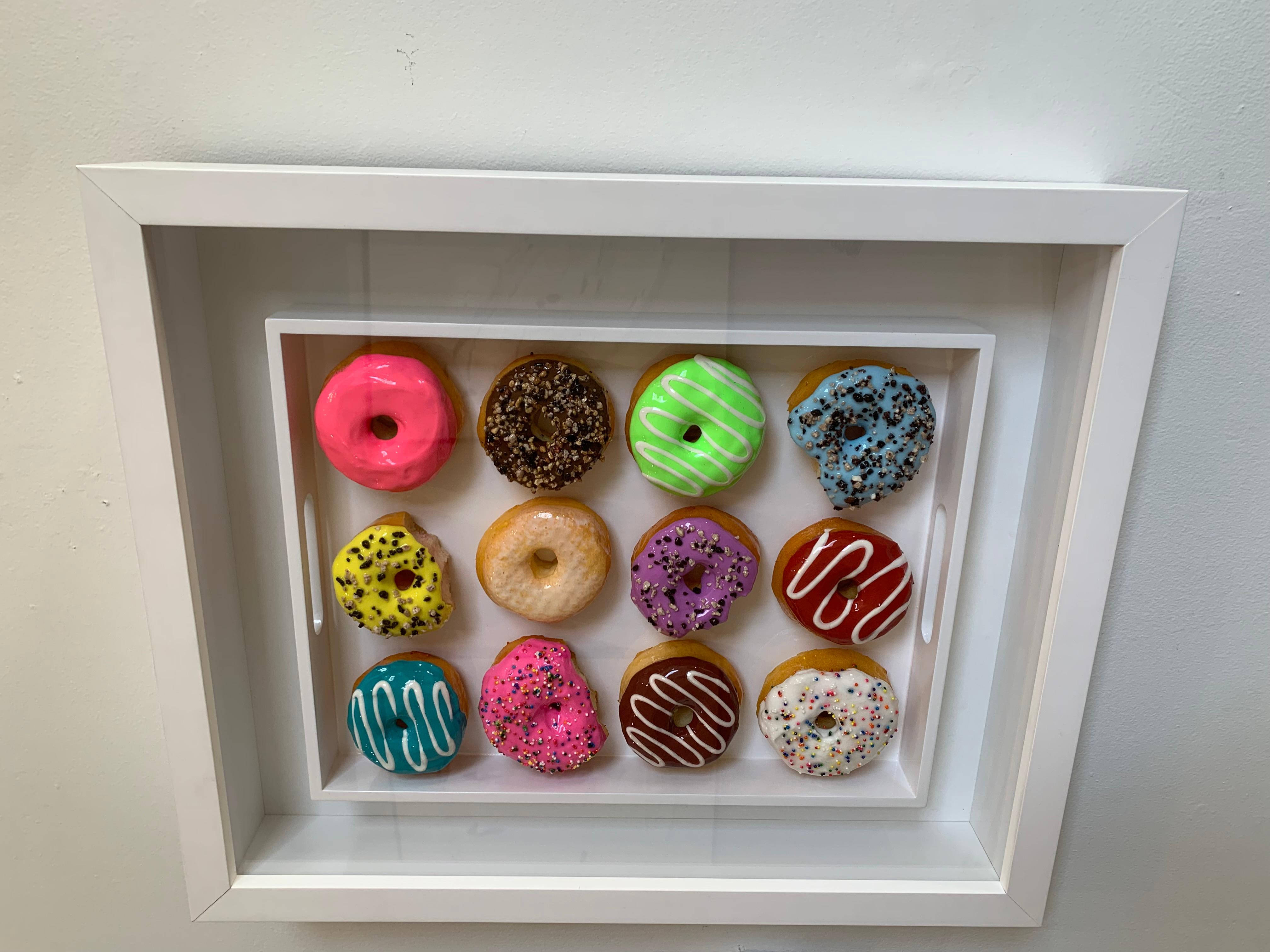 A hand created Sculpture to satisfy any dessert or doughnut lover!.

 *This price includes the shipping 

 Framed in white to make the donut tray “pop” &  covered with plexi glass to keep dust out.  

-framed size is approx 25” x 21” x 4”

-Wire on