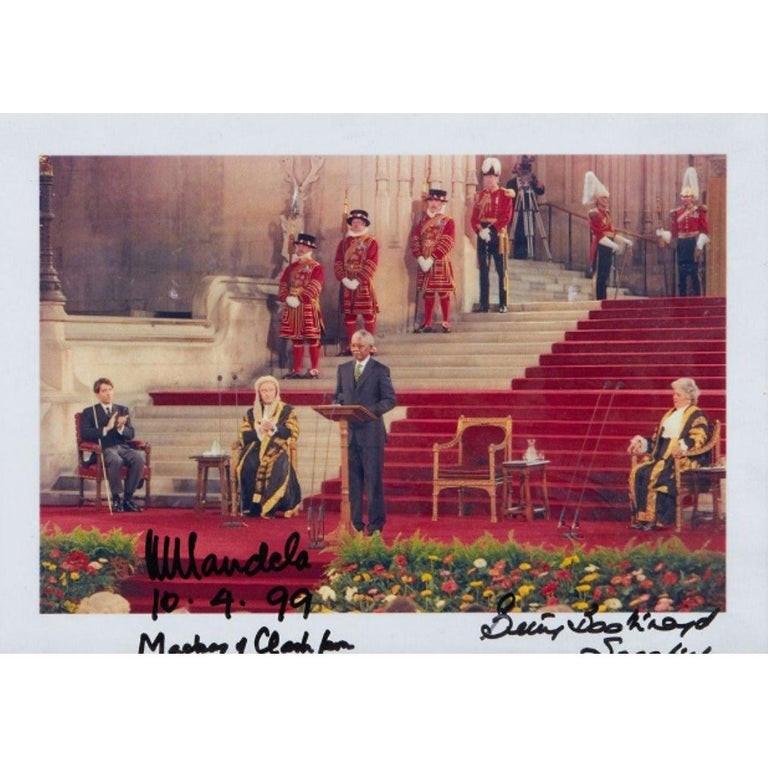 A Nelson Mandela autograph on photo, taken during his historic first state visit to Britain in 1996.

The photograph:

This color photograph depicts Mandela giving his historic speech to Parliament on July 11, 1996.

The photograph also