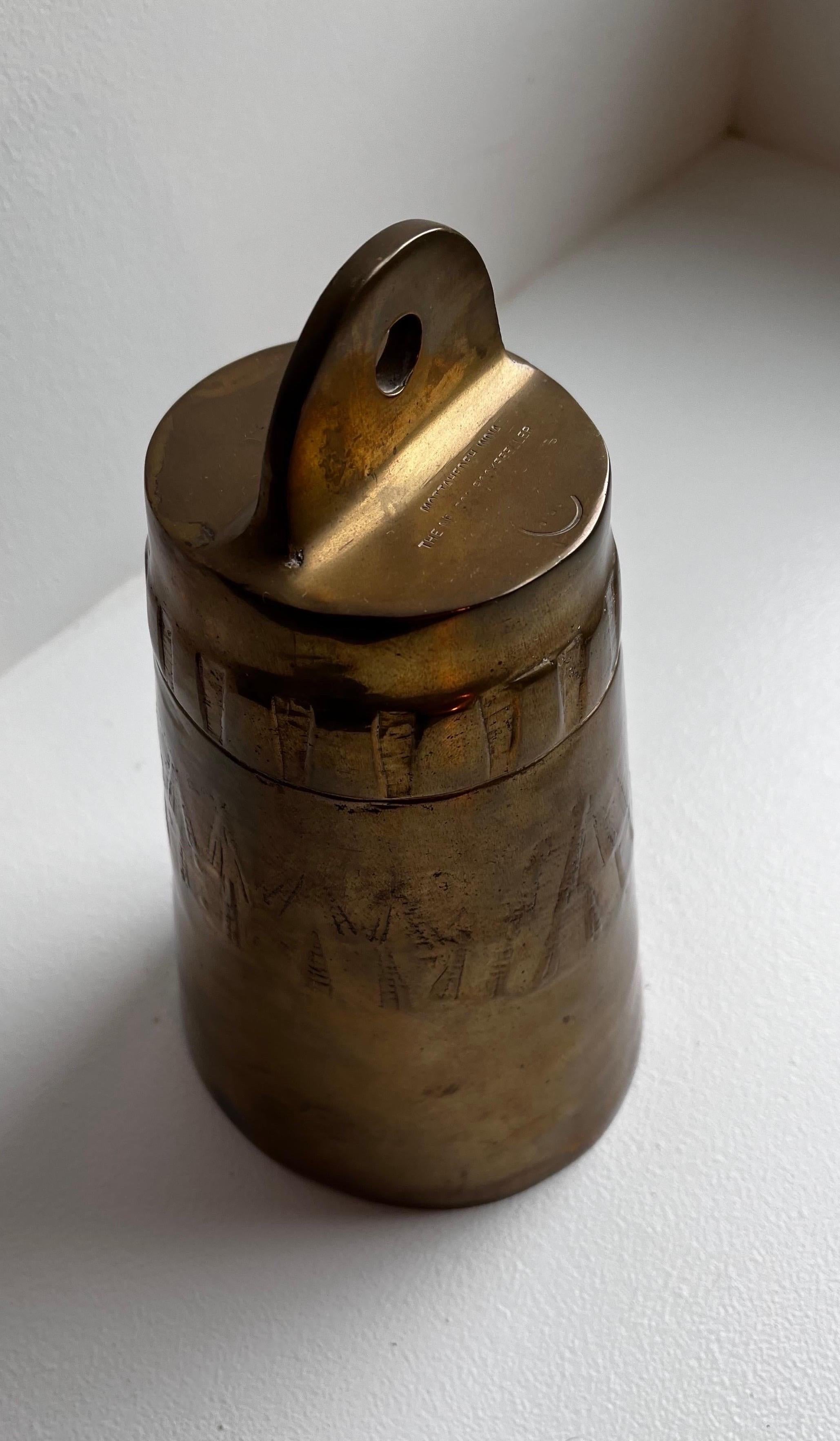 Nelson Rockefeller Collection reproduction brass bell by Mottahedeh
Very unusual bell with three bells in one.
Very heavy for the size.

Partial stamp on top: 
