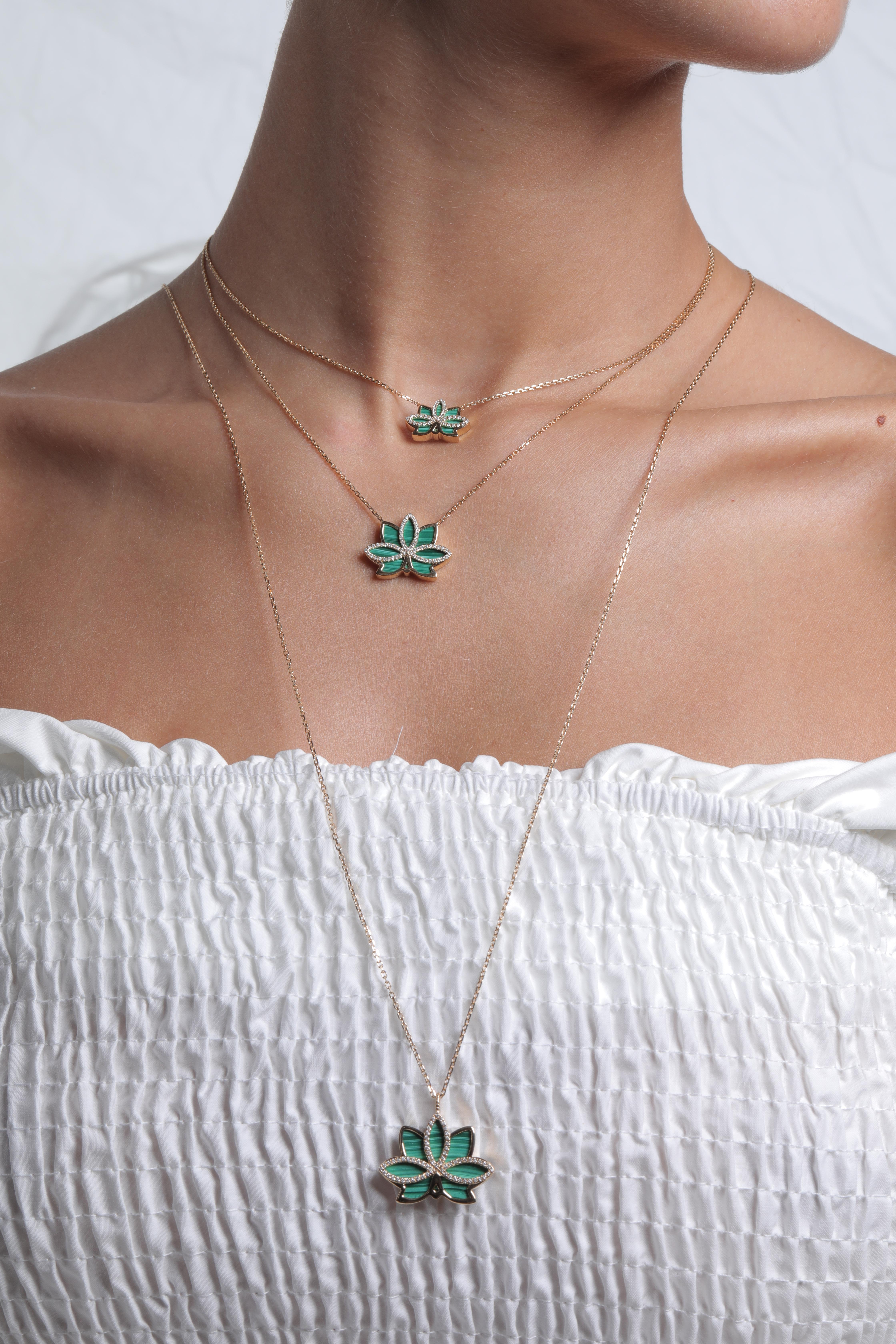 This is a beautiful Malachite necklace with an elegant long gold chain. Smooth, this gemstone will rest nicely on your neck, giving both color and a calming presence. This Necklace is perfect for just about any occasion!

Made from 18k gold,