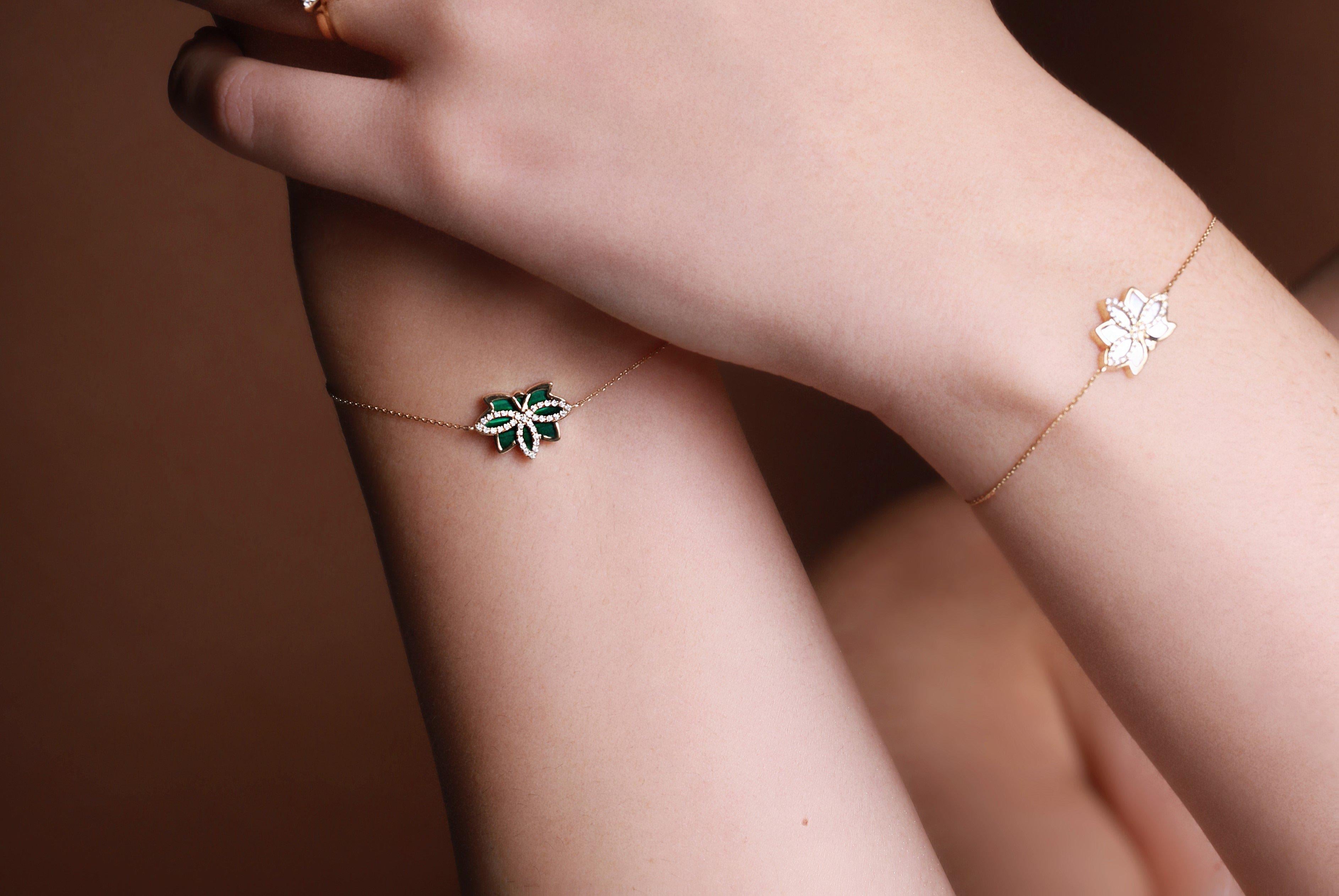 Our Nelumbo Malachite bracelet combines both strength and elegance to create a luxurious piece that will go perfectly with any outfit you put on! The bracelet drapes gracefully around your wrist without adding too much weight.

Made from 18k gold,