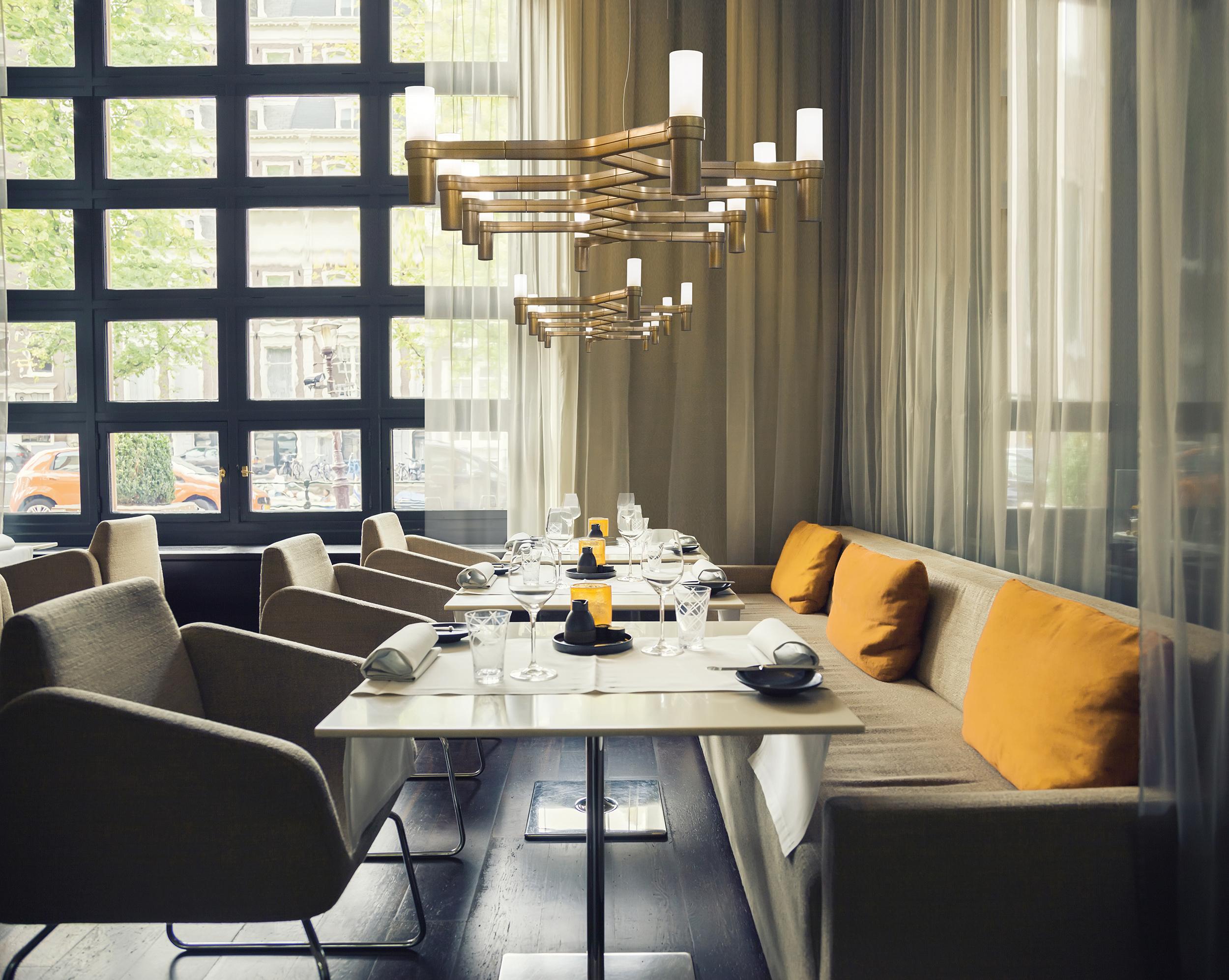 Family of pendant chandeliers, wall and floor lamps, with modular structure in die-casted aluminum and sandblasted glass diffusers. Structure in hand polished aluminum, glossy gold plated, black plated, or painted in matte white, matte black or