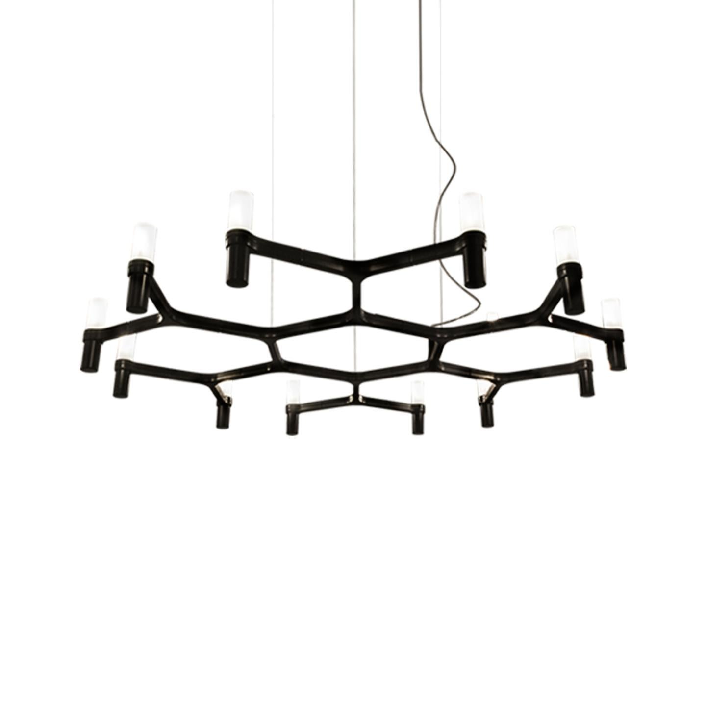 Pendant chandelier whose shape is inspired by the outline of the snow crystal. Modular lamps with a die-casted aluminum structure and sandblasted glass diffusers. Structure is available in different finishes: hand polished aluminum, glossy gold