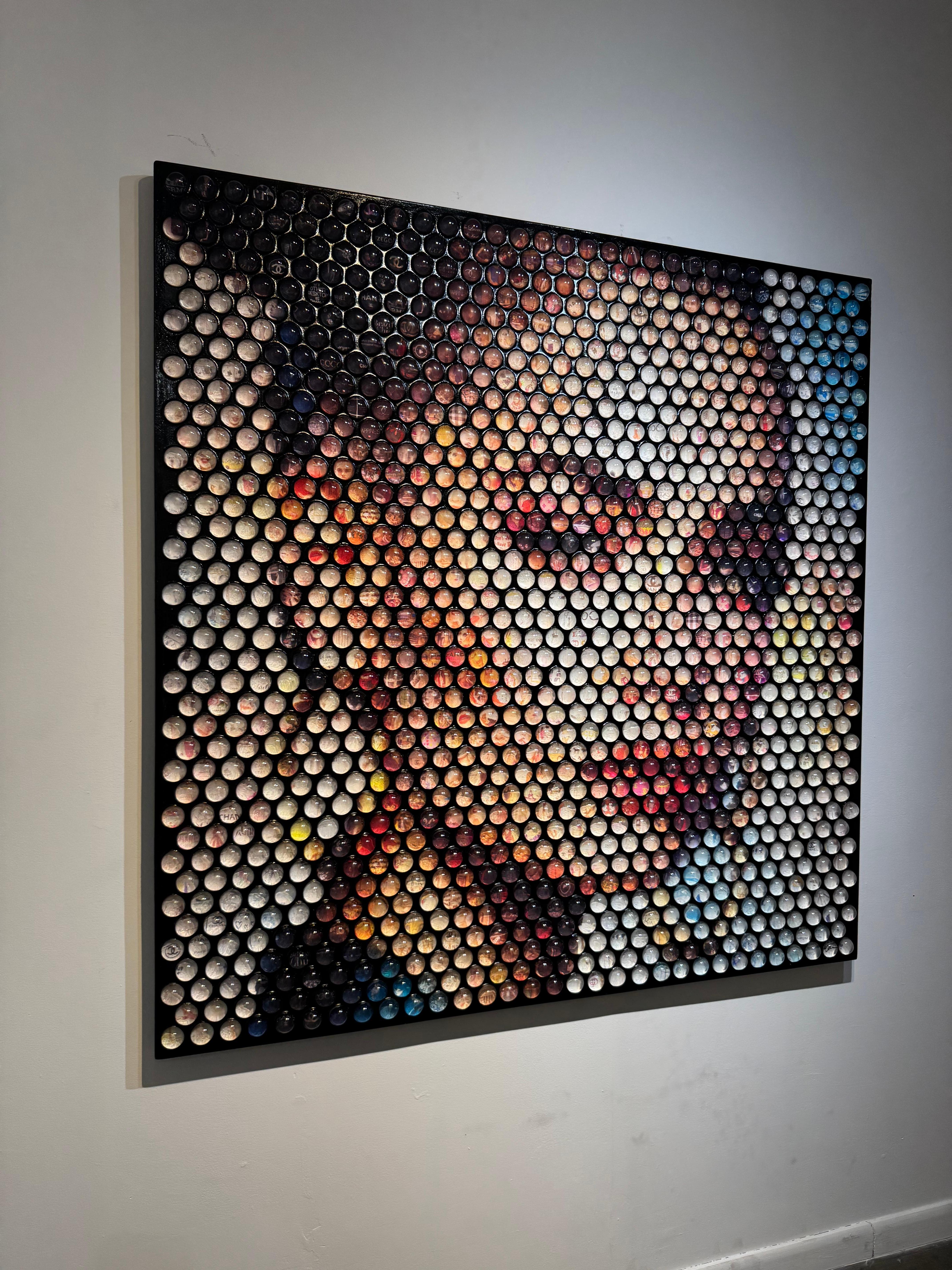 In the latest series, inspired by media, pop culture, and film Jantzen takes Neo-pointillism to the next level utilizing thousands collection of photography, cinematographic stills, and other collected material encapsulated in glass spheres; hiding