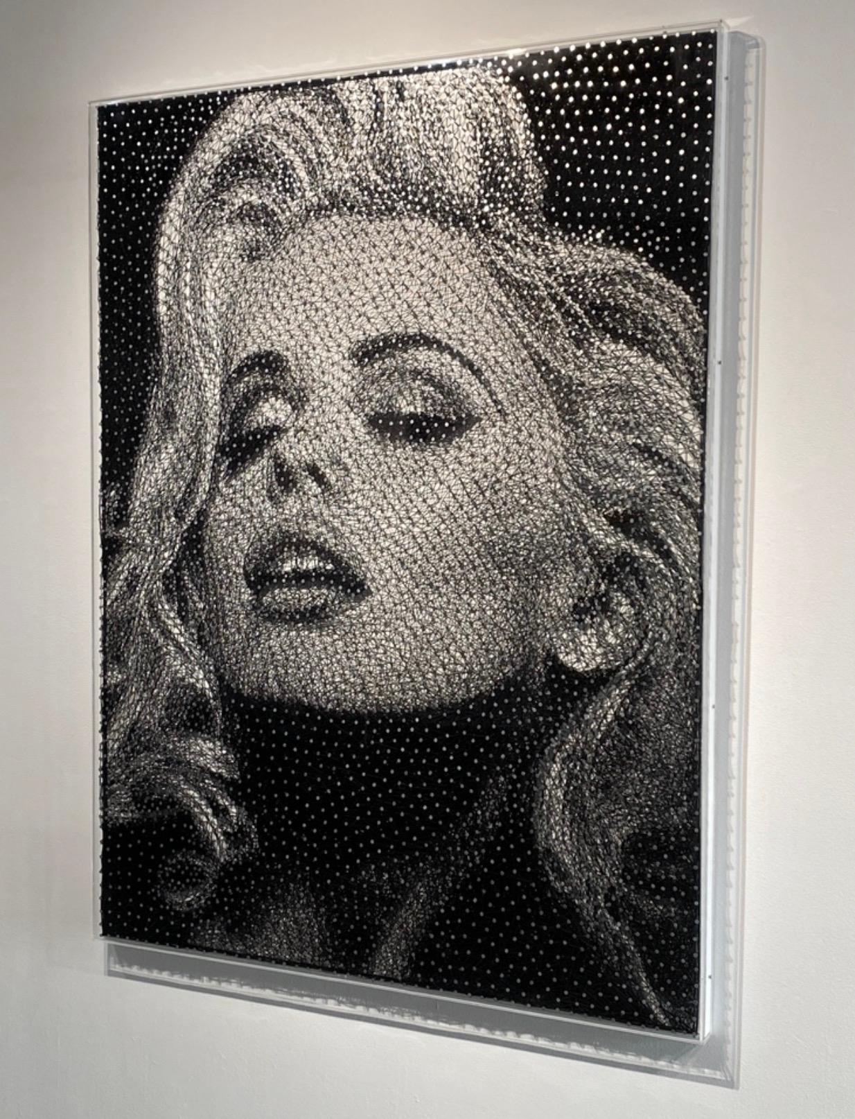 In the latest series, inspired by media, pop culture, and film Jantzen takes Neo-pointillism to the next level utilizing thousands collection of photography, cinematographic stills, and other collected material encapsulated in glass spheres; hiding