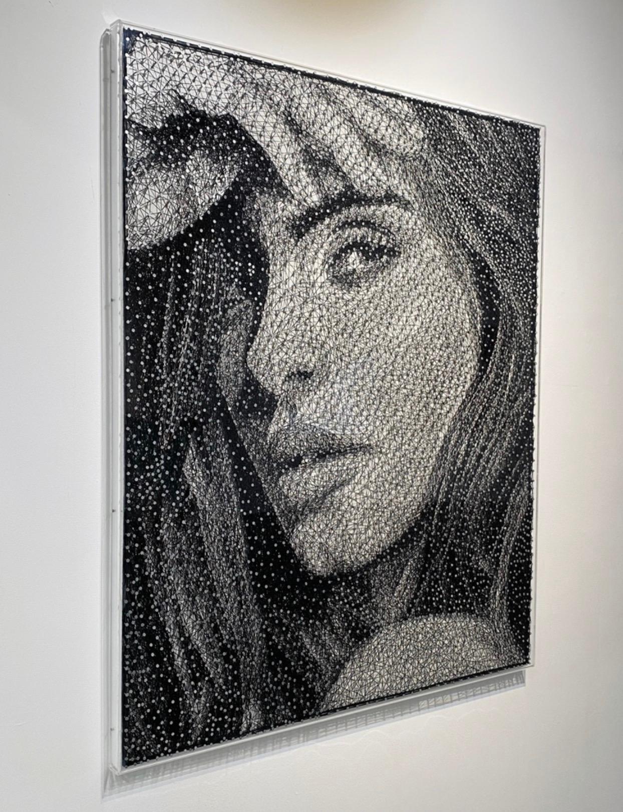 Thread is expertly wrapped around embedded nails to create a beautiful portrait of a woman. The distinct medium uses layering and gradients to create a unique sense of depth and texture.

In the latest series, inspired by media, pop culture, and