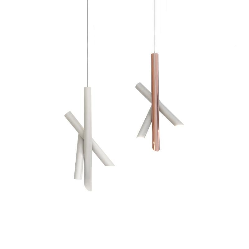 Family of pendant, wall and ceiling lamps, made with tubular elements for a strong and essential design expressed through pure forms. The wall versions are in extruded aluminum are rotatable and adjustable and are also available with push dimmer